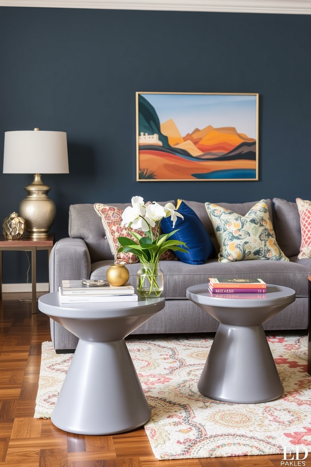 Stylish gray side tables with unique shapes complement the overall aesthetic of the family room. The room features a cozy seating arrangement with a plush gray sofa and vibrant accent pillows, creating a welcoming atmosphere.