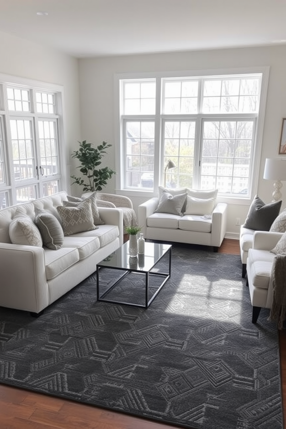 A cozy family room featuring a charcoal gray rug that adds warmth to the space. The room is furnished with white sofas and chairs that provide a clean and modern contrast. Natural light floods in through large windows, enhancing the inviting atmosphere. Decorative throw pillows in soft textures and muted tones are scattered across the seating for added comfort.