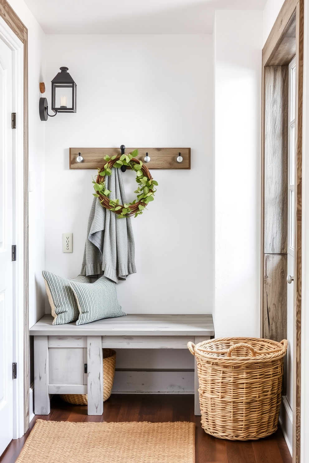 A cozy foyer featuring rustic gray wood accents that add warmth and character. The walls are painted in a soft white, complemented by a distressed gray wood bench and a woven basket for storage.