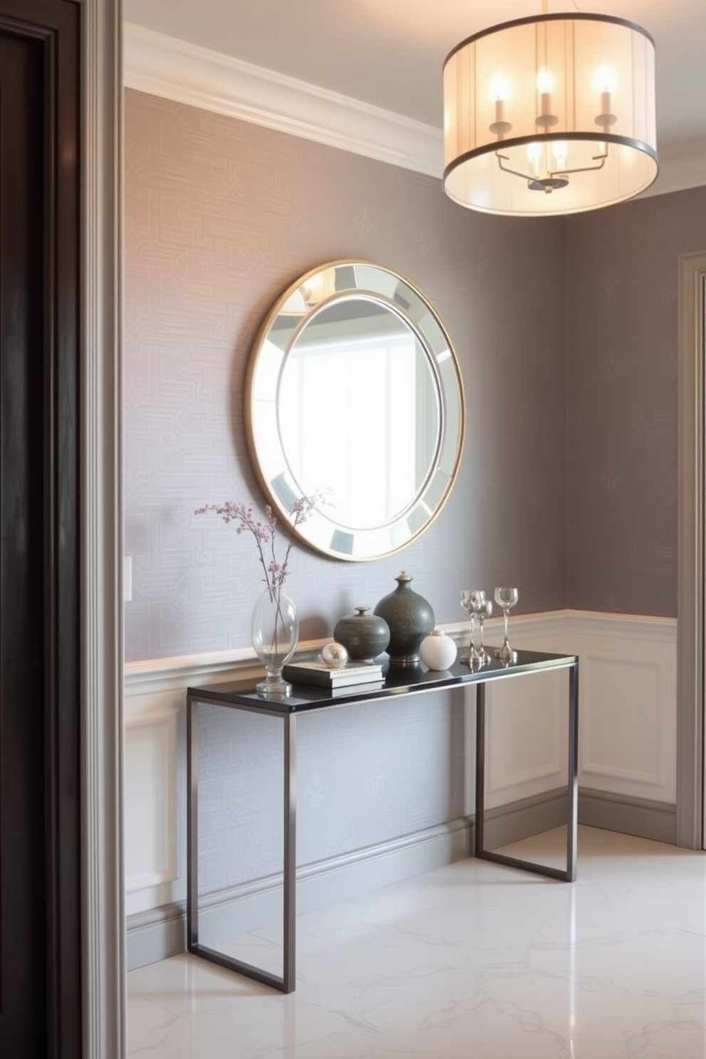 A stunning foyer adorned with gray wallpaper featuring subtle metallic accents creates an elegant first impression. The space is enhanced by a sleek console table topped with decorative objects and a stylish mirror that reflects the light.