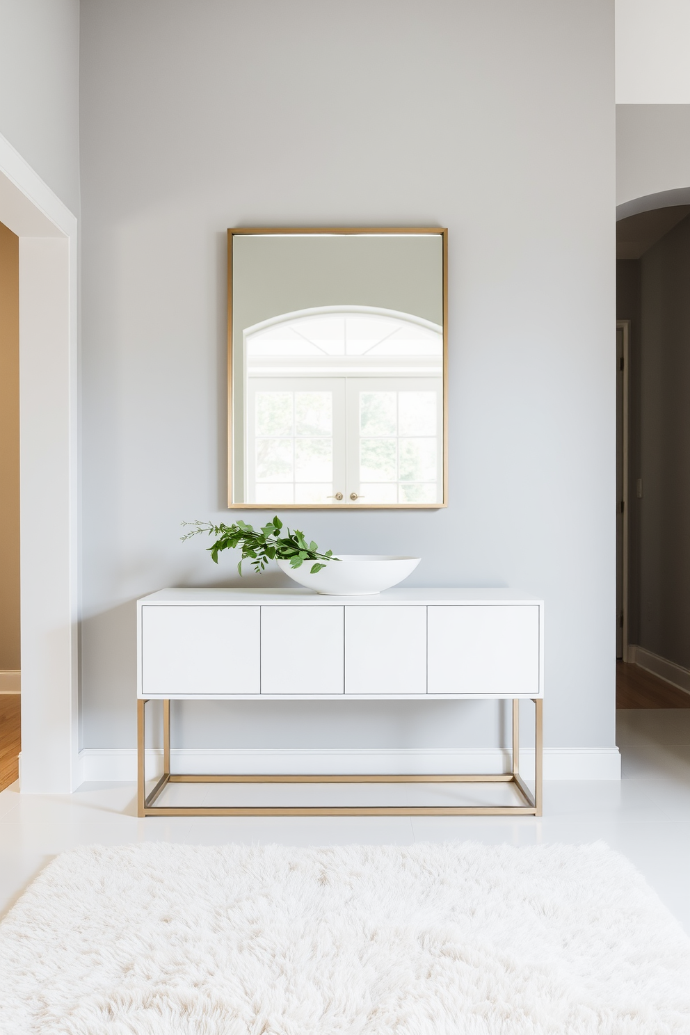 A serene foyer featuring a gray and beige color scheme that promotes a sense of calm. The walls are adorned with soft gray paint, while a plush beige area rug lies beneath a sleek console table. On the console table, a decorative bowl holds fresh greenery, adding a touch of nature. A stylish mirror with a simple frame hangs above the table, reflecting light and enhancing the spacious feel of the entryway.