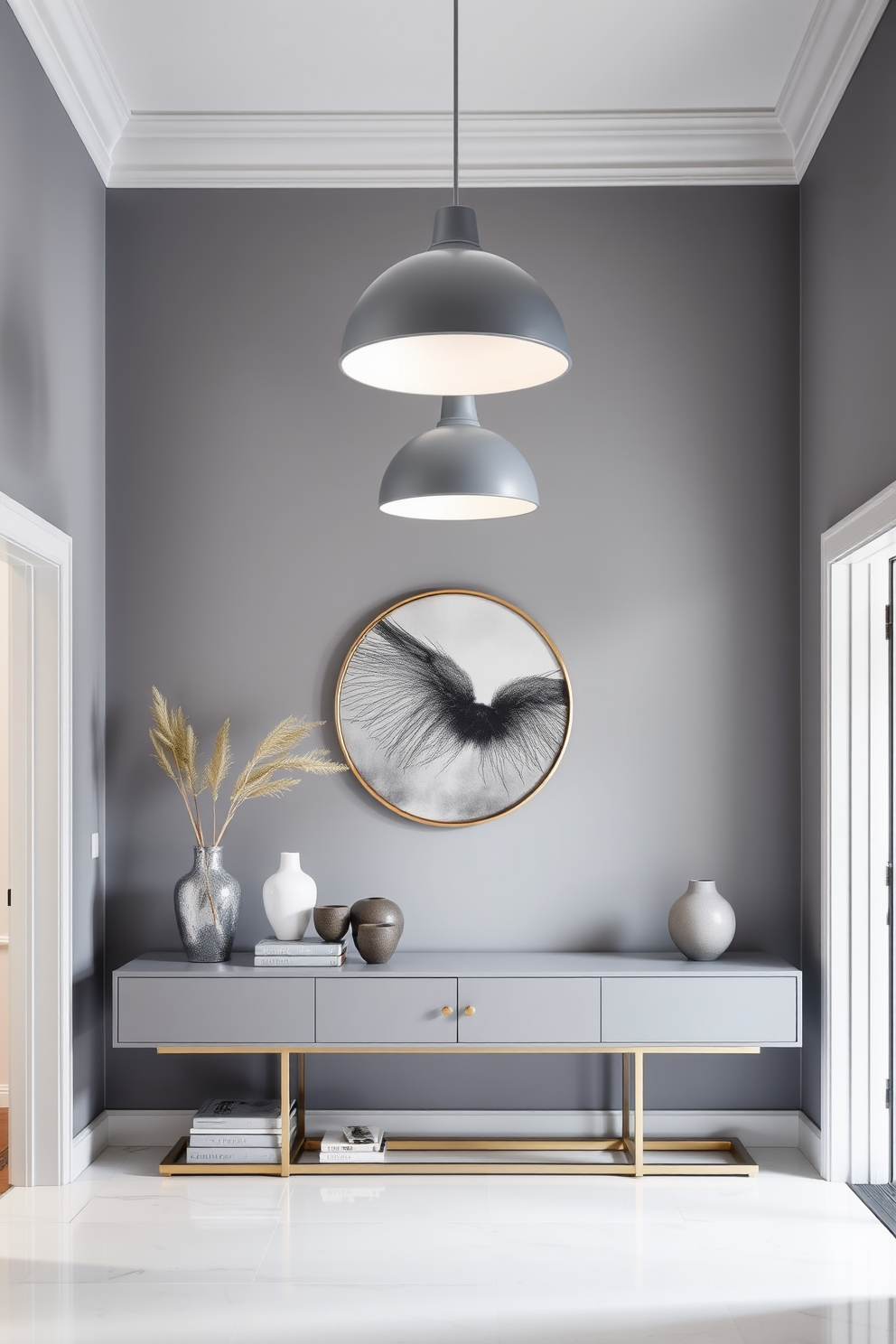 A chic foyer with gray pendant lights providing stylish illumination. The walls are painted in a soft gray hue, complemented by a sleek console table adorned with decorative accents.