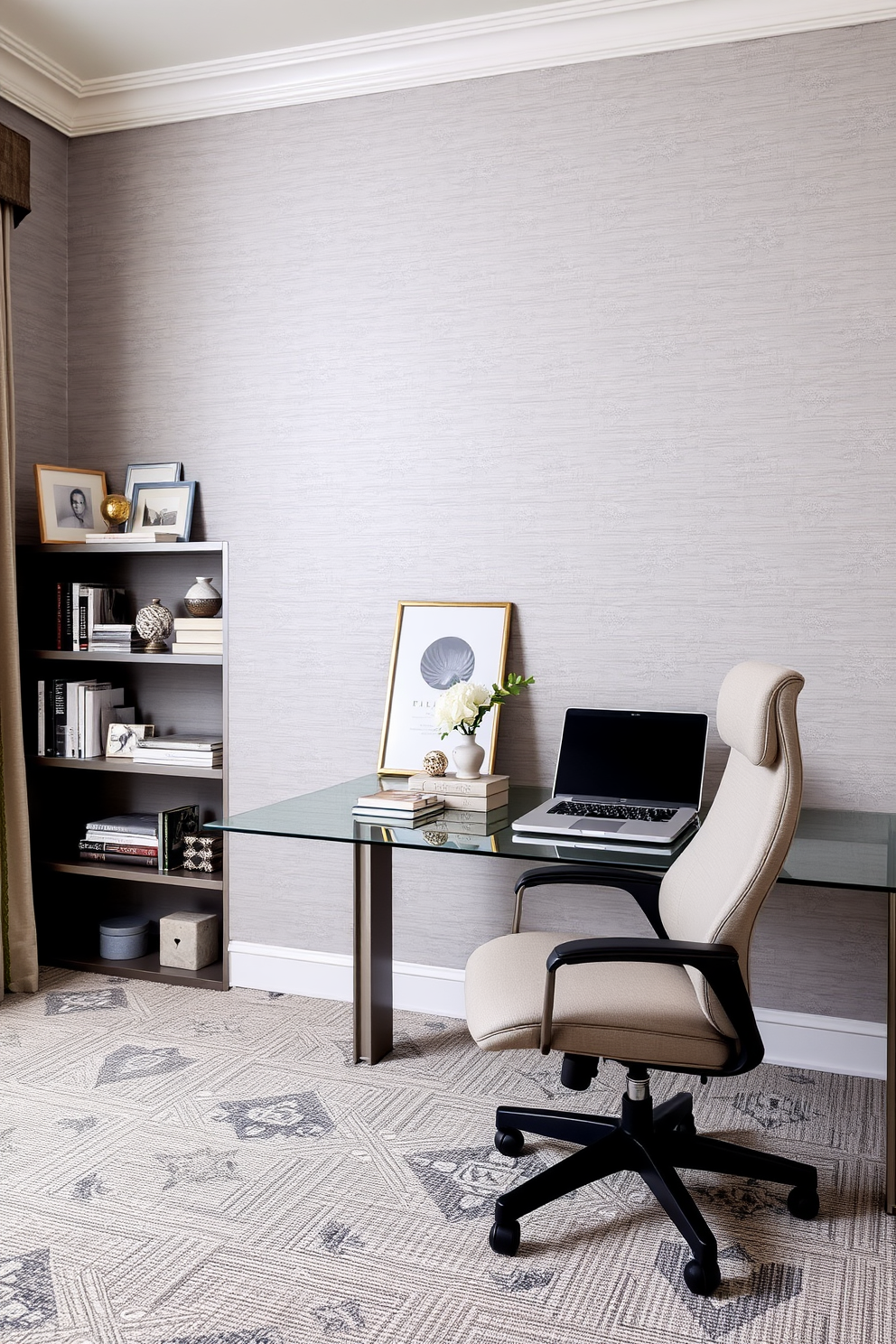 Elegant gray wallpaper with subtle patterns creates a serene backdrop for a sophisticated home office. A sleek glass desk is paired with a plush ergonomic chair, while a stylish bookshelf displays curated decor and books.