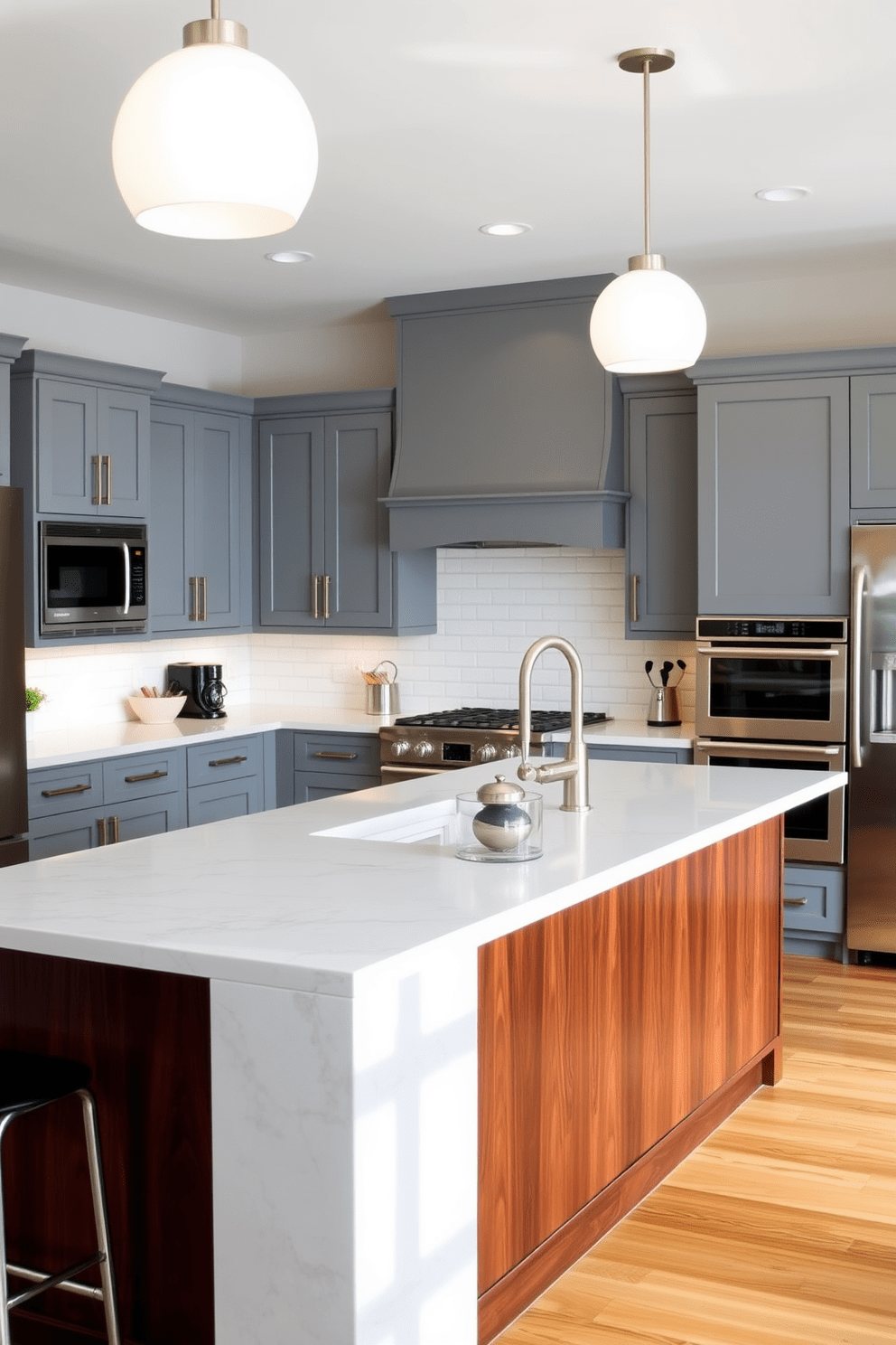 A stunning gray kitchen featuring a large island with a contrasting dark wood base. The island is complemented by sleek gray cabinets and modern stainless steel appliances, creating a harmonious balance of colors. Bright pendant lights hang above the island, casting a warm glow over the workspace. The backsplash is adorned with white subway tiles, adding a touch of classic elegance to the contemporary design.