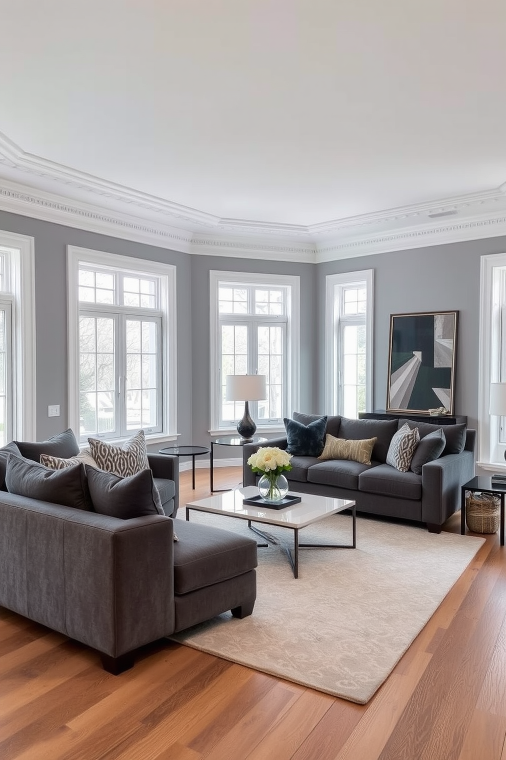 A stylish gray living room features crisp white trim that enhances the elegant ambiance. Plush gray sofas are arranged around a sleek coffee table, with decorative throw pillows adding pops of color. A contemporary area rug lies beneath the seating area, providing warmth and texture. Large windows allow natural light to flood the space, highlighting the minimalist decor and art pieces on the walls.