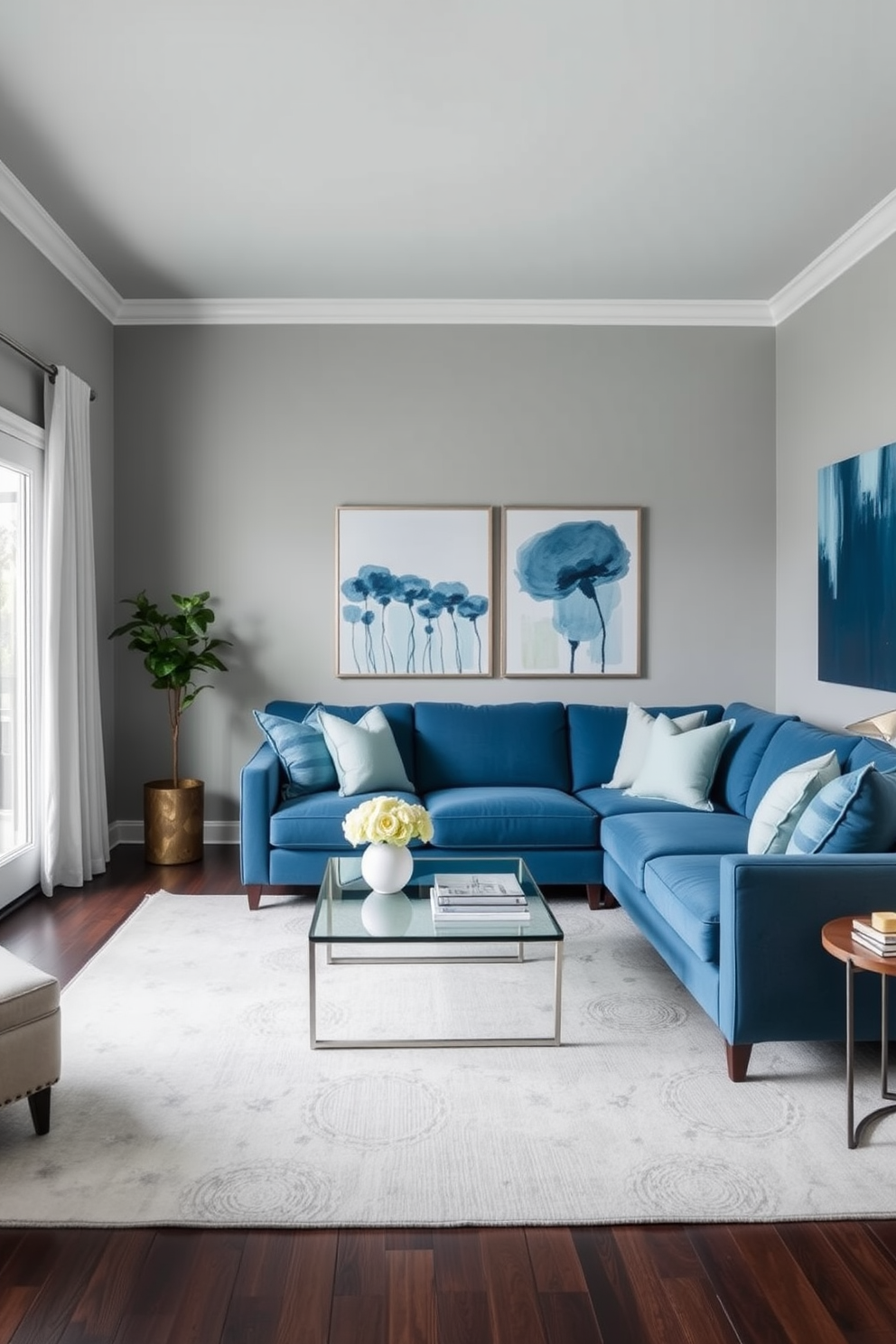 A serene living room featuring a gray and blue color palette. The walls are painted in a soft gray, complemented by a plush blue sectional sofa and a sleek glass coffee table. Accent pillows in varying shades of blue add depth and comfort. A large area rug with subtle geometric patterns anchors the space, while modern artwork in blue tones adorns the walls.