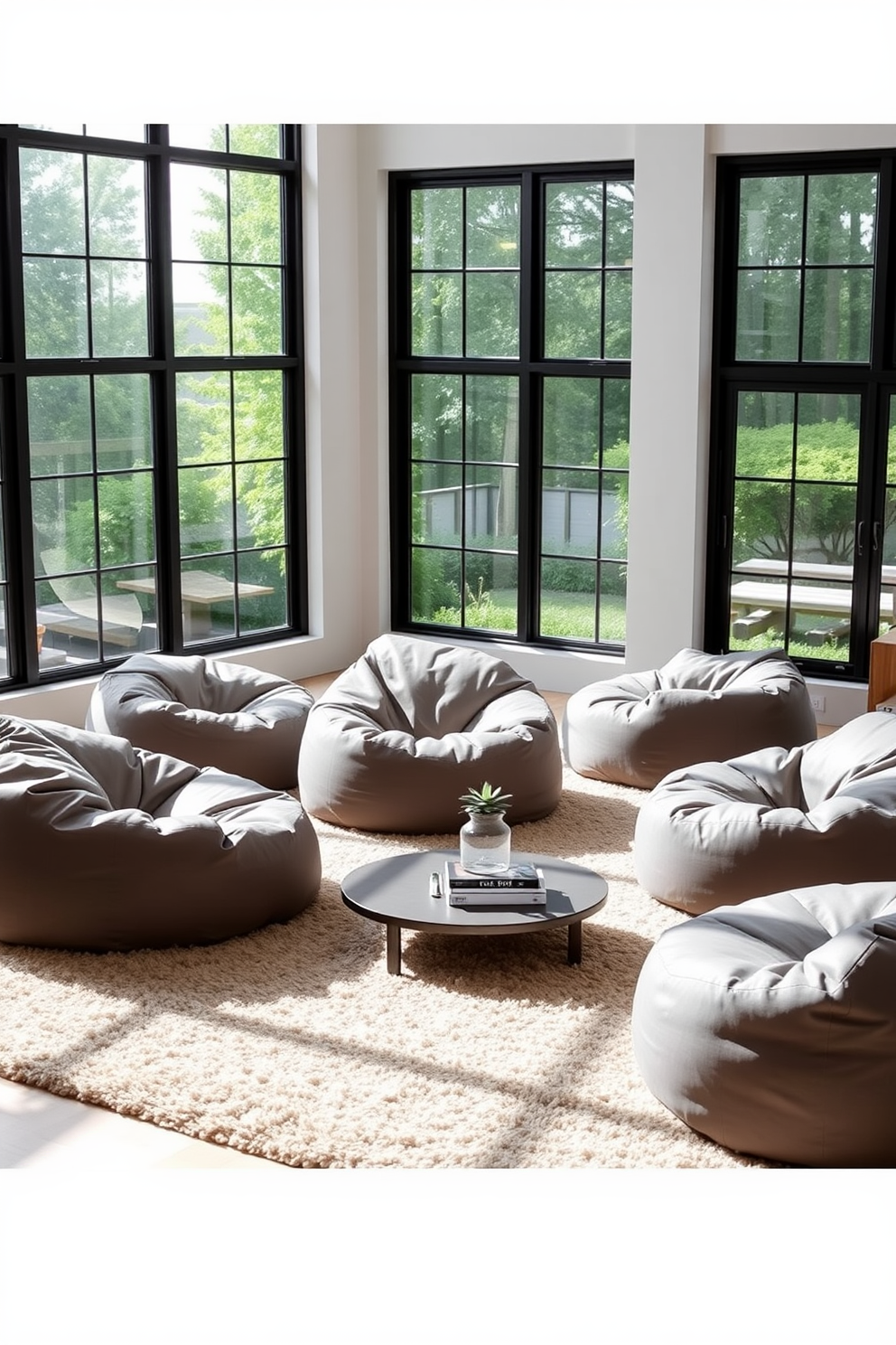 Contemporary gray bean bags are scattered throughout a spacious living room, providing a relaxed and inviting atmosphere. The room features large windows that allow natural light to flood in, highlighting the soft textures of the bean bags. The walls are painted in a light gray tone, complementing the plush beige carpet underfoot. A low-profile coffee table sits in the center, adorned with a few art books and a small succulent for a touch of greenery.