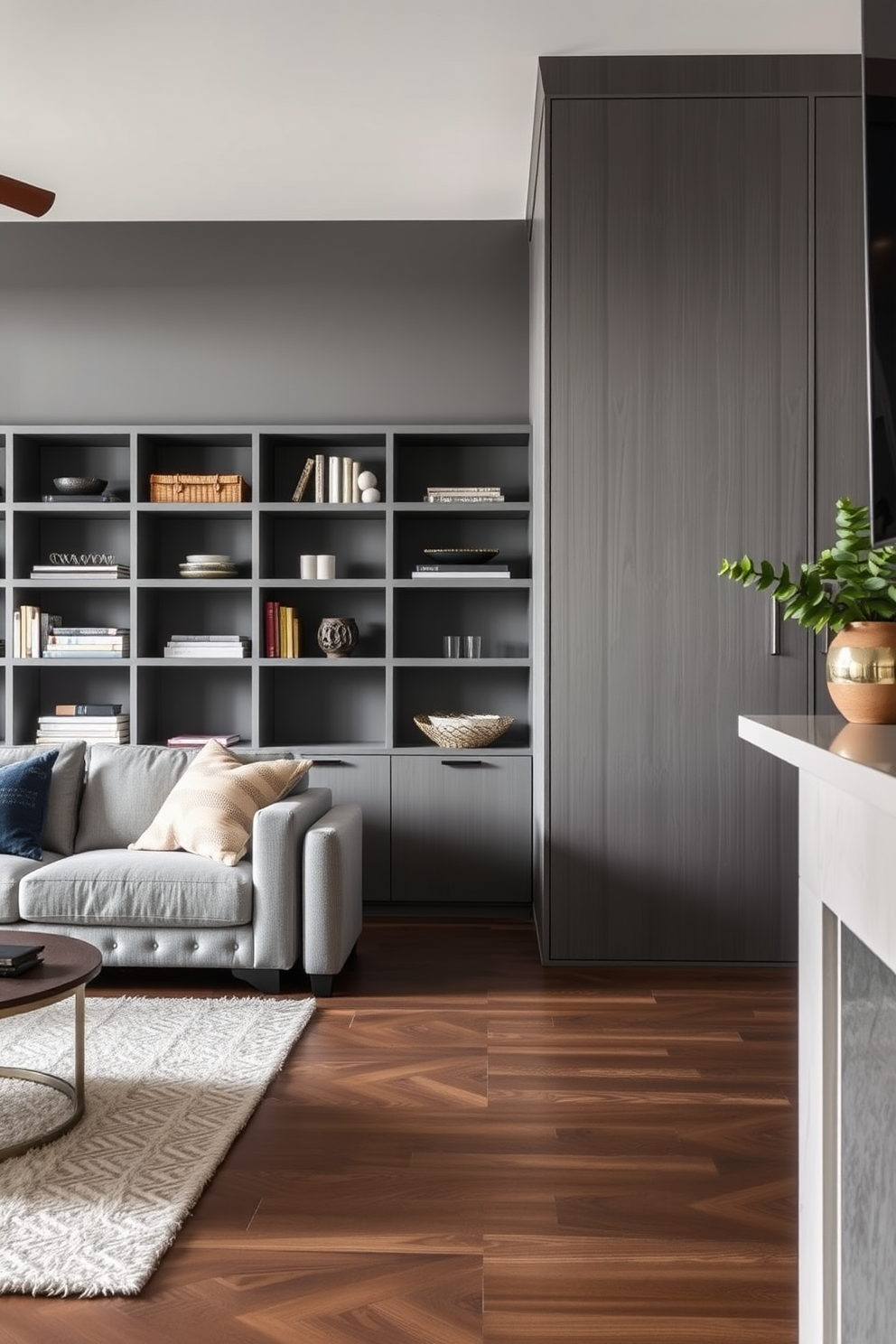 A modern living room featuring open shelving in a sleek gray finish. The space is accented with minimalist furniture and soft textures, creating a cozy yet sophisticated atmosphere.