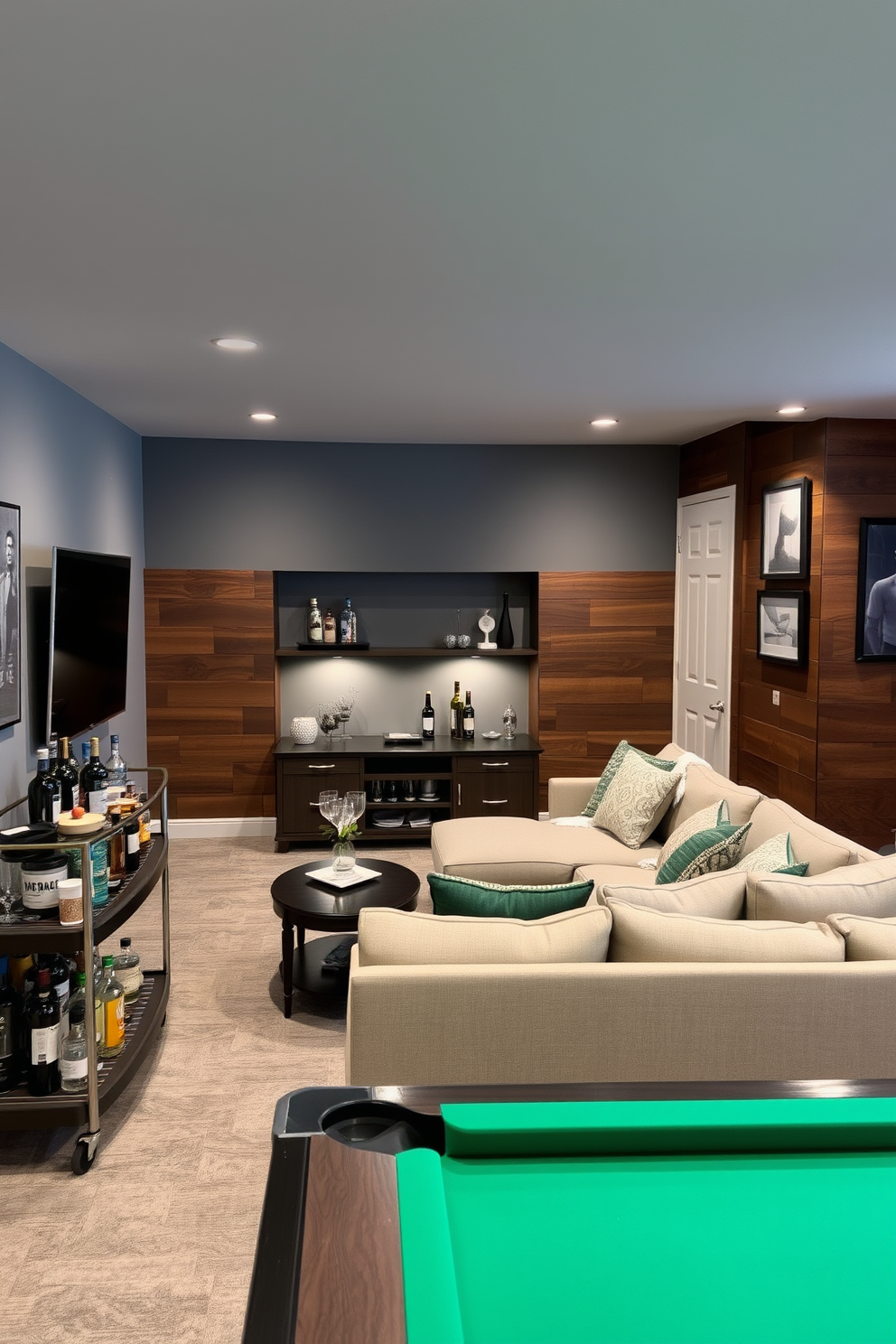 A stylish man cave featuring a gray accent wall complemented by rich wood paneling. The space includes a plush sectional sofa facing a sleek entertainment center, with ambient lighting creating a cozy atmosphere. In one corner, a modern bar cart is stocked with various spirits and glassware, while a pool table adds a fun recreational element. Decorative art pieces and framed photographs adorn the walls, enhancing the personalized feel of the room.