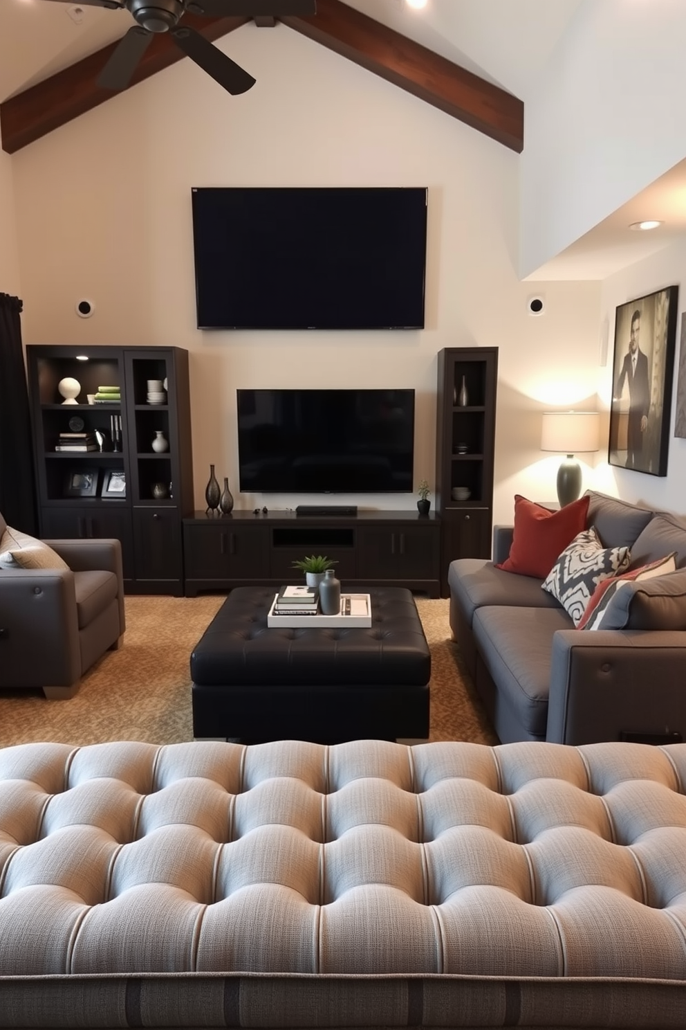 Cushioned gray ottoman for extra seating in a stylish man cave. The space features a cozy layout with a large sectional sofa and a wall-mounted flat-screen TV, complemented by ambient lighting and dark wood accents.