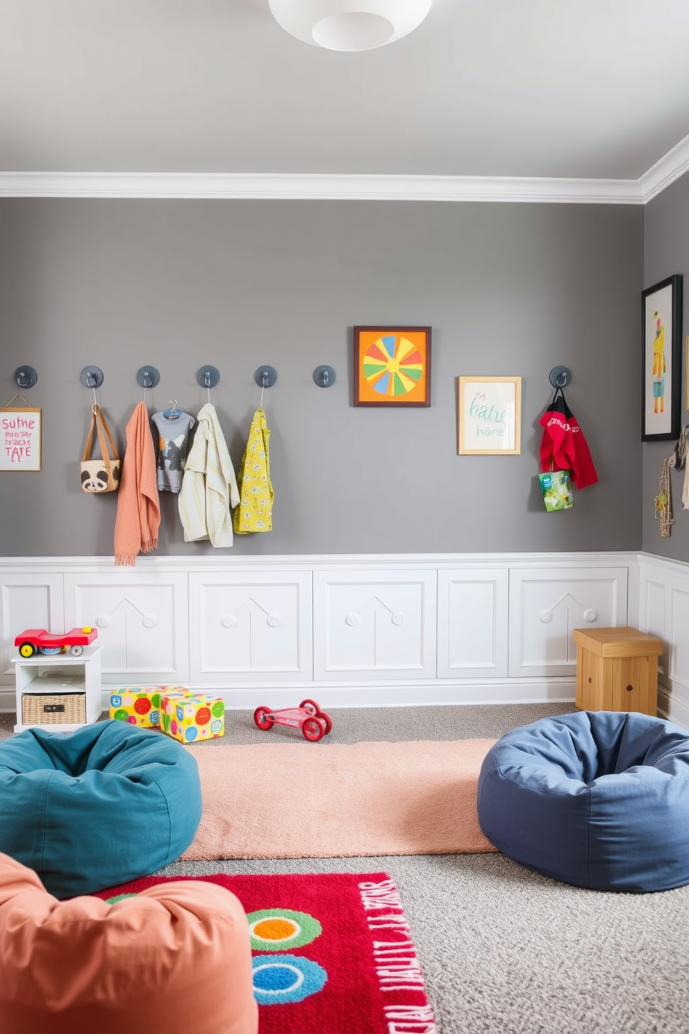 A playful playroom with gray walls that create a soothing atmosphere. The space features gray wall hooks for easy storage, providing a functional yet stylish solution for organizing toys and games. Colorful rugs and bean bags are scattered across the floor, inviting creativity and comfort. Bright artwork adorns the walls, adding a cheerful touch to the gray-themed design.