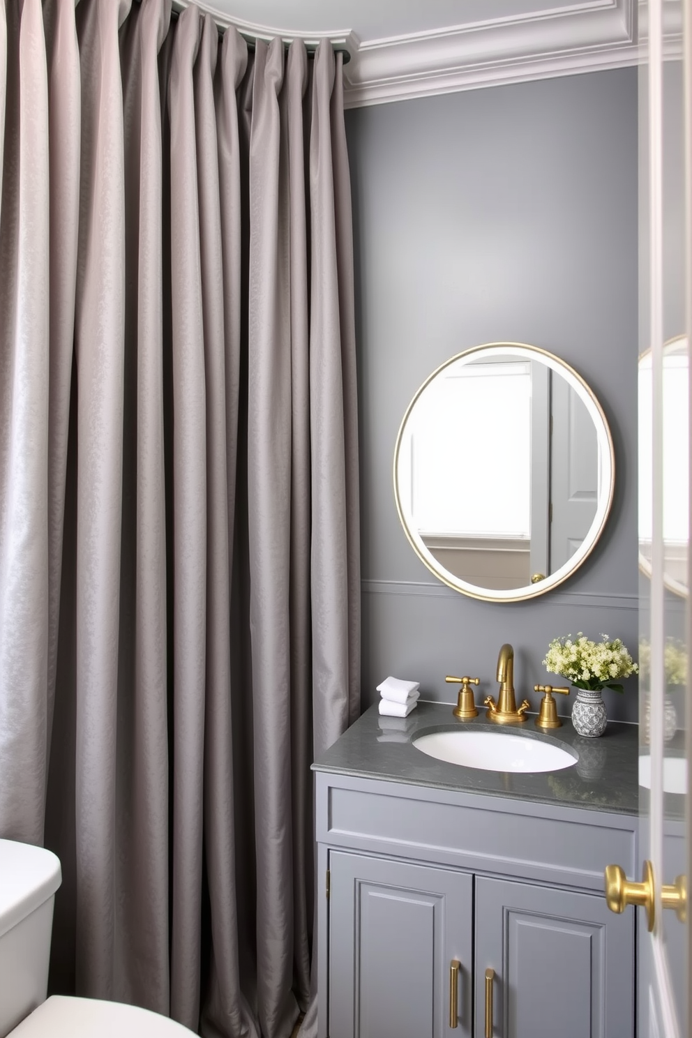 Luxurious gray velvet curtains drape elegantly from the ceiling, adding a touch of softness and sophistication to the space. The powder room features a sleek gray color palette with a stylish vanity, complemented by gold fixtures and a chic mirror that enhances the overall ambiance.