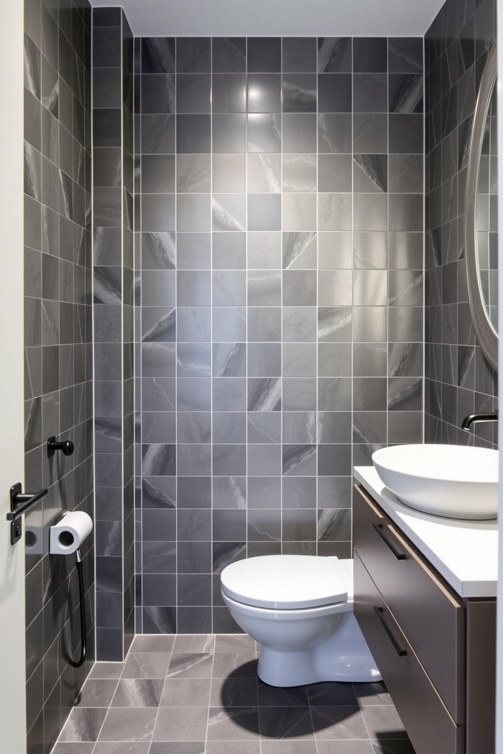 A contemporary powder room featuring geometric gray tiles that create a striking visual impact. The walls are adorned with sleek, minimalist fixtures and a stylish floating vanity with a modern sink.