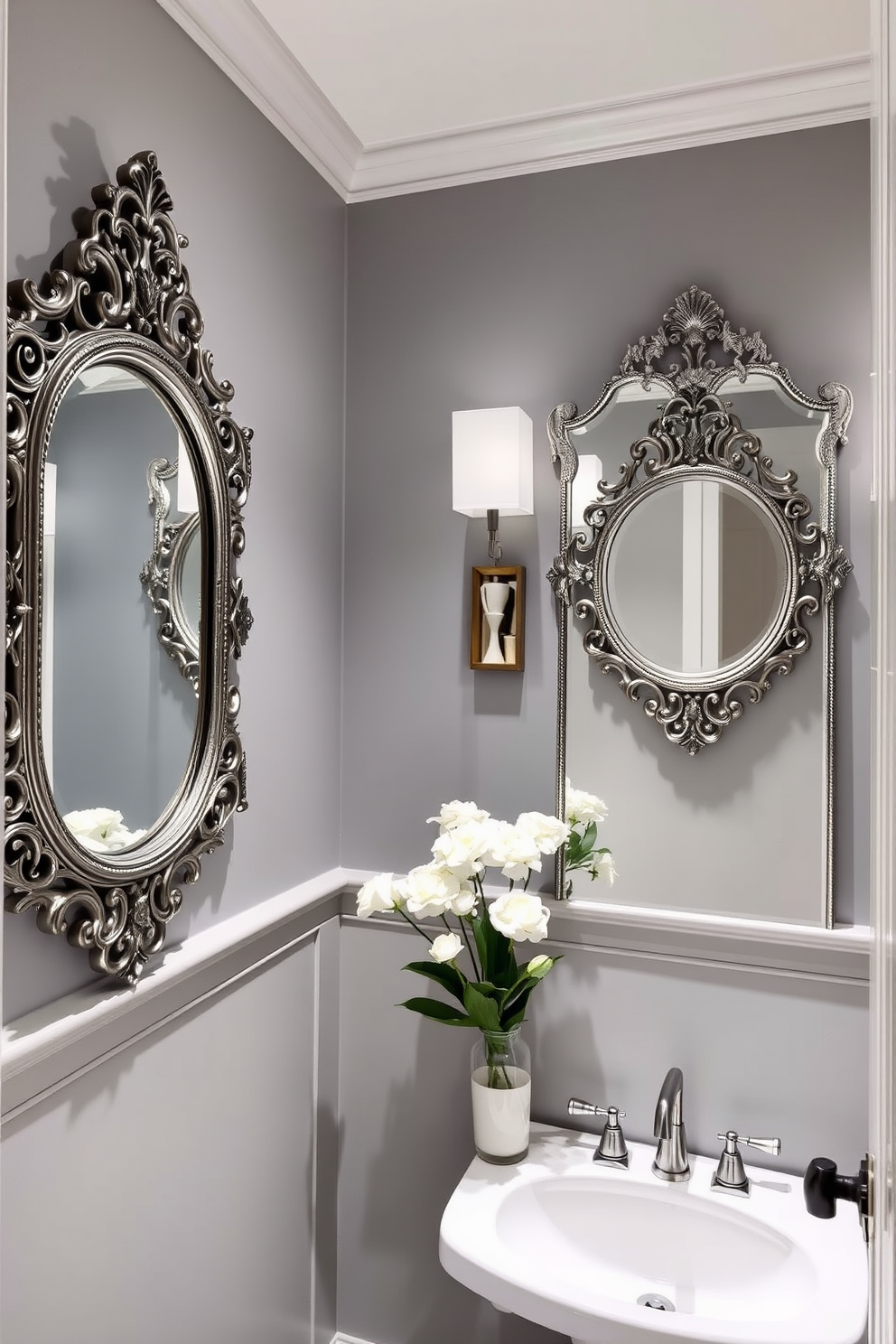 A chic gray powder room featuring vintage mirrors that add a touch of elegance to the space. The walls are painted in a soft gray hue, creating a serene backdrop for the ornate mirrors that reflect the room's stylish decor.