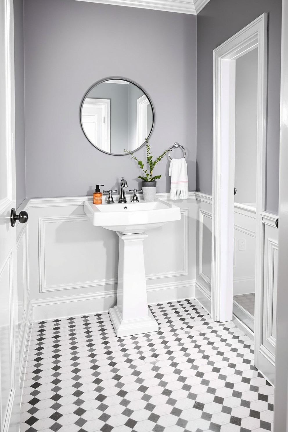 Classic gray and white checkerboard flooring creates a timeless and elegant foundation for the powder room. The walls are painted in a soft gray hue, complementing the striking floor pattern and enhancing the overall sophistication of the space. A sleek, white pedestal sink is positioned against one wall, adorned with polished chrome fixtures. Above the sink, a round mirror with a minimalist frame reflects the stylish ambiance, while a small potted plant adds a touch of greenery and warmth.