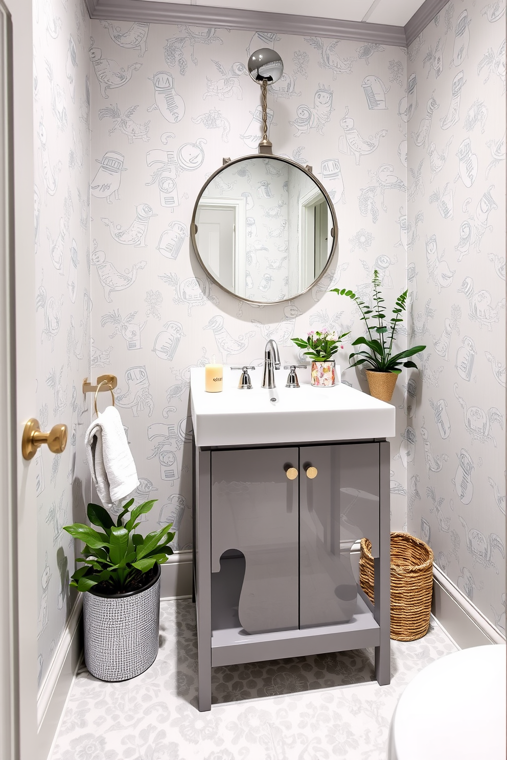 A whimsical gray powder room features playful patterns in the textiles, creating a lighthearted yet elegant atmosphere. The walls are adorned with a soft gray wallpaper that showcases intricate, whimsical designs, while the floor is tiled with a complementary gray and white pattern. The vanity is a sleek, modern design with a polished chrome faucet and a round mirror that adds a touch of sophistication. Accents of greenery, such as potted plants or fresh flowers, bring life to the space, enhancing the overall charm of the powder room.