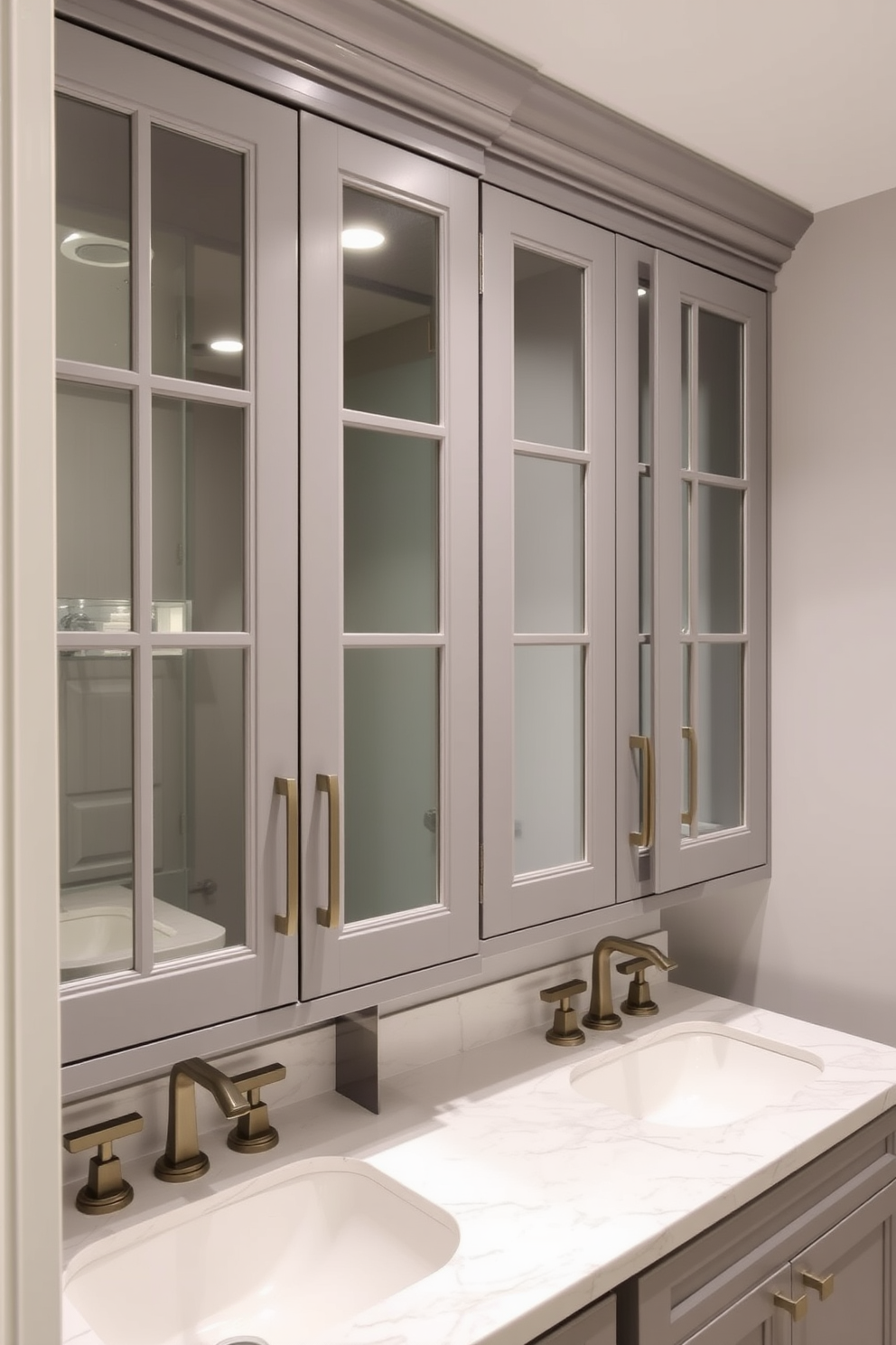 Elegant gray cabinetry with glass doors creates a sophisticated ambiance in the powder room. The space features a sleek marble countertop with stylish fixtures that complement the cabinetry.