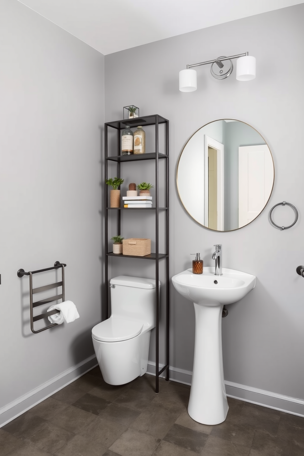 A stylish powder room featuring industrial gray concrete flooring that complements the overall aesthetic. The walls are painted in a soft gray tone, and a sleek pedestal sink is positioned against one wall, with a large round mirror above it reflecting the modern lighting fixtures. To enhance the industrial vibe, a metal shelving unit displays decorative items and plants. A minimalist towel rack made of brushed steel is mounted next to the sink, adding both functionality and style to the space.