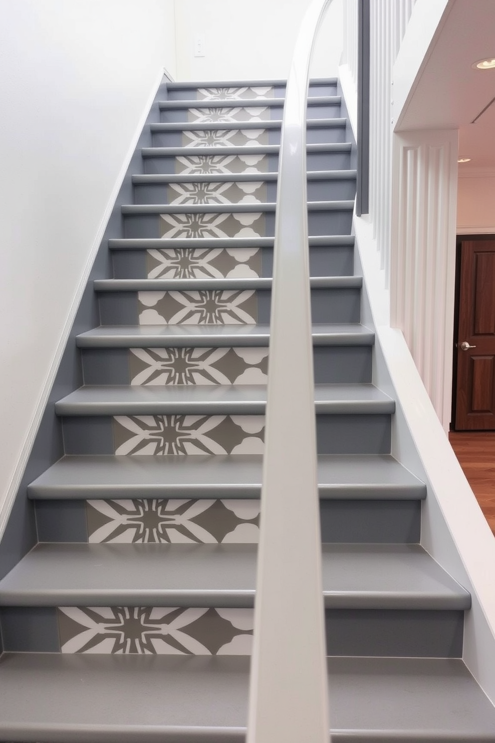 A stunning staircase features a gray and white color scheme with bold geometric patterns adorning the risers. The handrail is sleek and modern, complementing the contemporary aesthetic of the space.