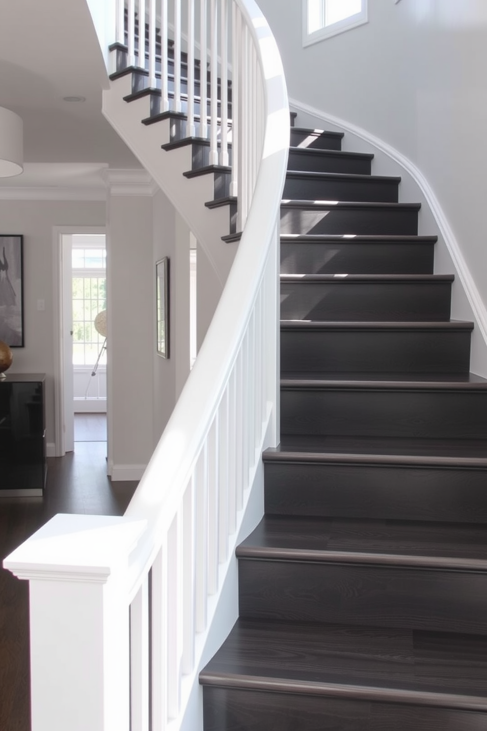 A stunning charcoal gray wooden staircase with sleek white accents creates a modern focal point in the home. The steps are elegantly designed, featuring a smooth finish that complements the surrounding decor. The handrail is a crisp white, contrasting beautifully with the dark wood of the staircase. Natural light floods the space, highlighting the rich texture of the charcoal gray wood and the clean lines of the design.