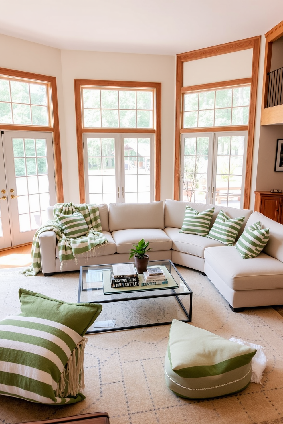 A cozy family room featuring green and white striped throw blankets draped over a plush sectional sofa. The walls are painted in a soft cream color, complemented by natural wood accents and large windows allowing ample sunlight to fill the space. A large area rug with subtle patterns anchors the seating area, while a coffee table adorned with decorative books and a small potted plant sits at the center. Decorative pillows in varying shades of green add texture and comfort, creating an inviting atmosphere for family gatherings.