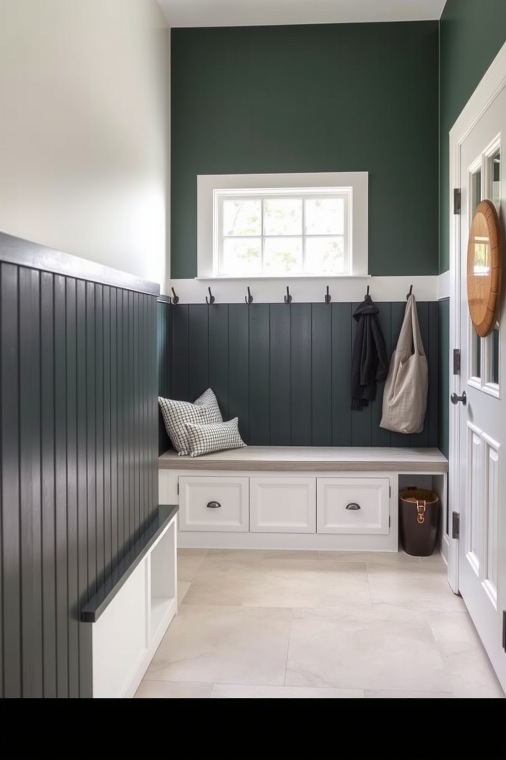 A stylish mudroom featuring a dark green shiplap accent wall that adds depth and character to the space. The floor is adorned with a light-colored tile that contrasts beautifully with the dark wall, creating a welcoming atmosphere. Functional storage solutions include a built-in bench with plush cushions and hooks for coats and bags. A large window allows natural light to flood the room, enhancing the rich green tones of the shiplap.