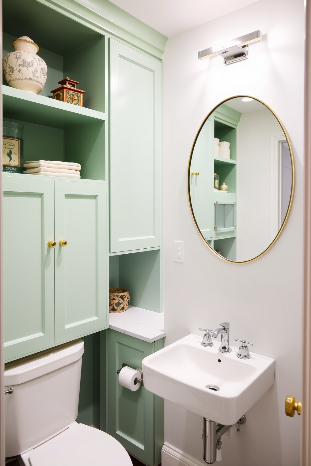 Pastel green cabinets adorn the walls, complemented by open shelving that showcases elegant decor items. The powder room features a chic, minimalist aesthetic with a stylish sink and modern fixtures, creating a refreshing atmosphere.