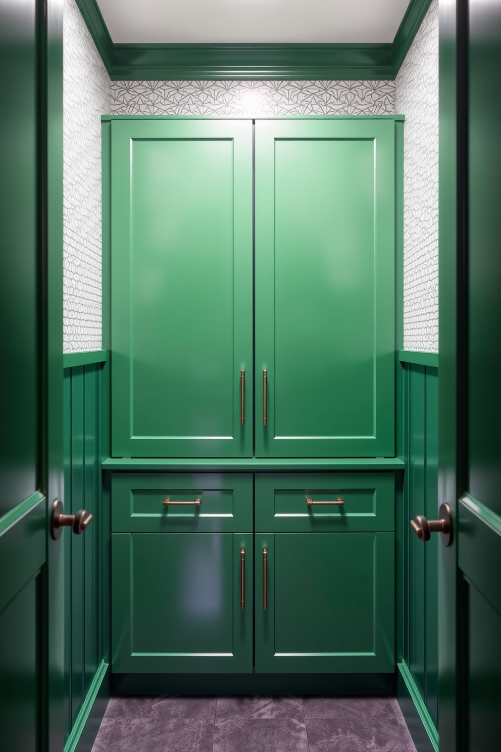 A bold green powder room featuring sleek cabinets with clean lines. The walls are adorned with a subtle geometric wallpaper that complements the cabinet color, creating a modern and inviting atmosphere.