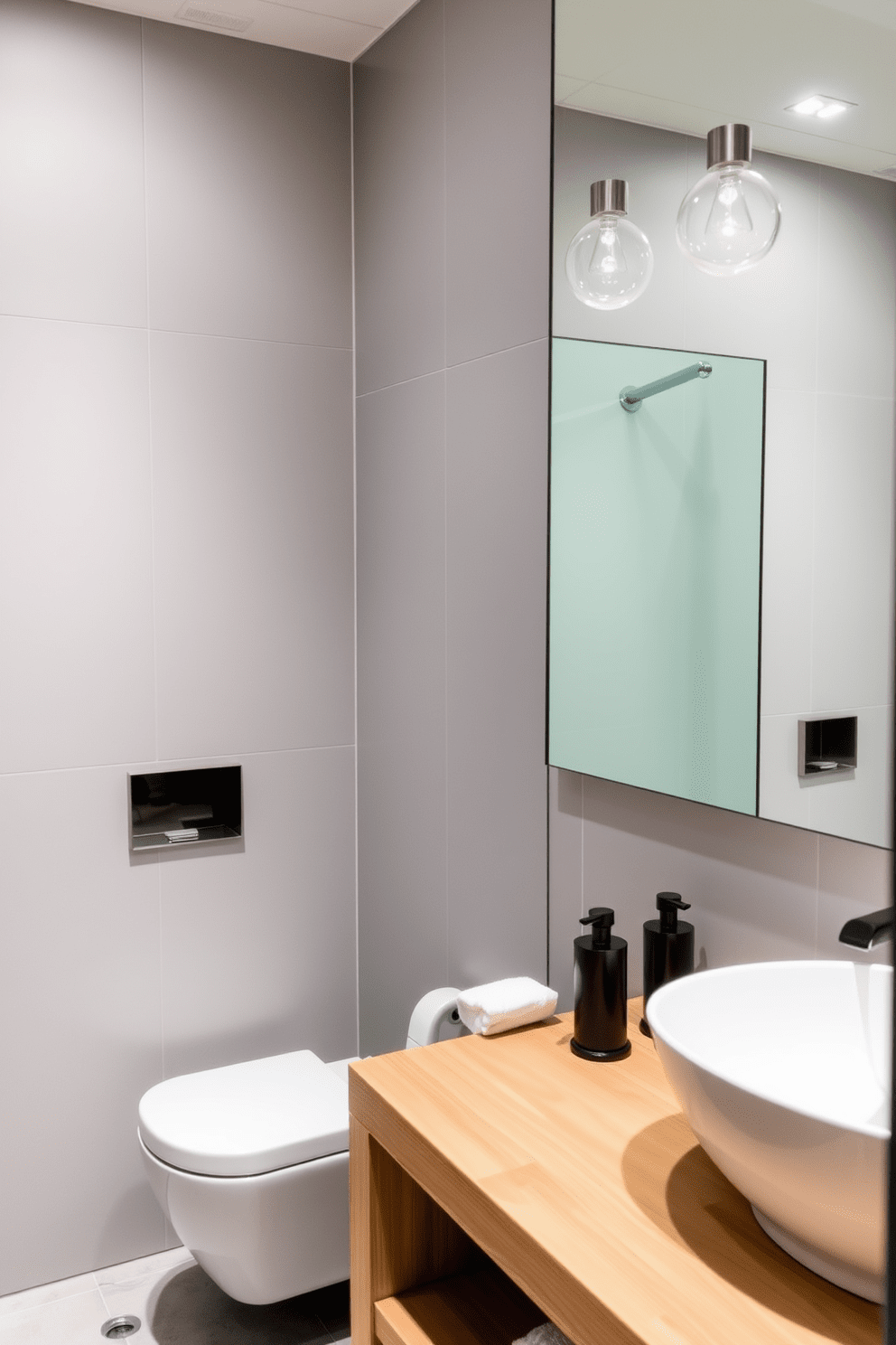 A guest bathroom featuring water-saving fixtures that blend functionality with style. The space includes a sleek low-flow toilet and a modern faucet designed to reduce water usage while maintaining a luxurious feel. The walls are adorned with light gray tiles that create a calming atmosphere. A floating vanity with a natural wood finish complements the eco-friendly theme, and a large mirror reflects the soft lighting from energy-efficient bulbs.