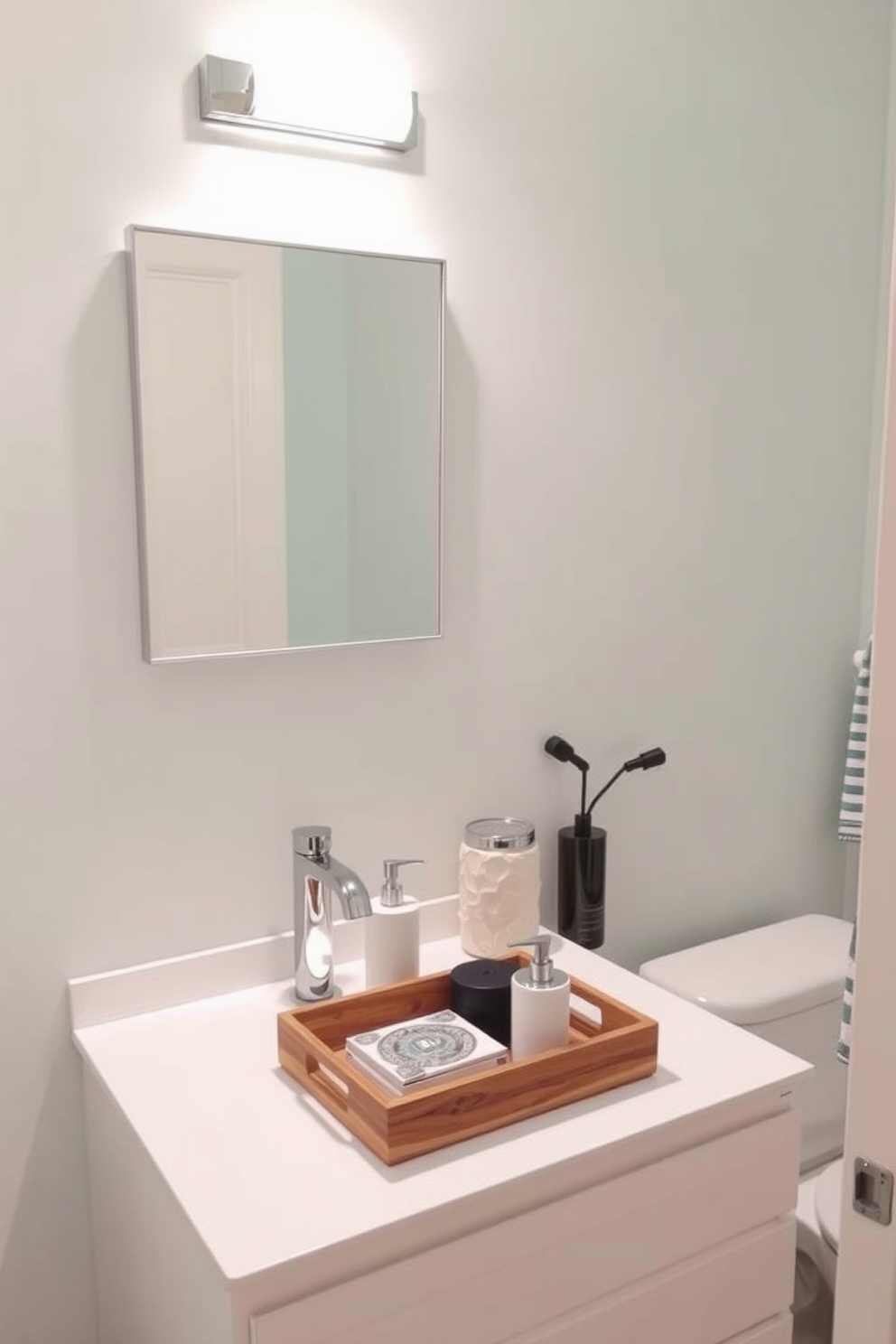 A stylish half bath featuring decorative trays that elegantly organize essentials. The trays are made of natural wood and ceramic, arranged on a sleek countertop next to a modern sink. The walls are painted in a soft pastel hue, creating a serene atmosphere. A chic mirror with a minimalist frame hangs above the sink, enhancing the room's spacious feel.