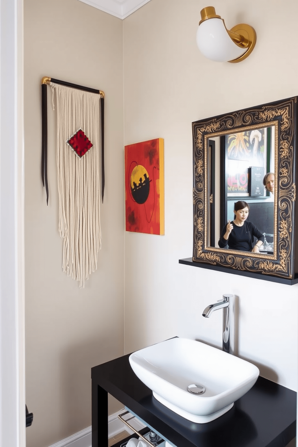 A stylish half bathroom featuring unique art pieces that add personality to the space. The walls are adorned with vibrant abstract paintings and a sculptural wall hanging that draws the eye. The vanity is a modern design with a sleek black finish and a white vessel sink. A decorative mirror with an artistic frame reflects the eclectic decor, while a small shelf displays curated art objects.