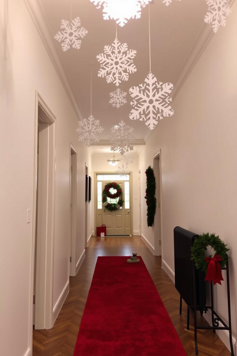 A festive hallway adorned with snowflake cutouts hanging gracefully from the ceiling. The walls are painted in a soft white hue, and the floor is covered with a plush red runner that adds warmth to the space.