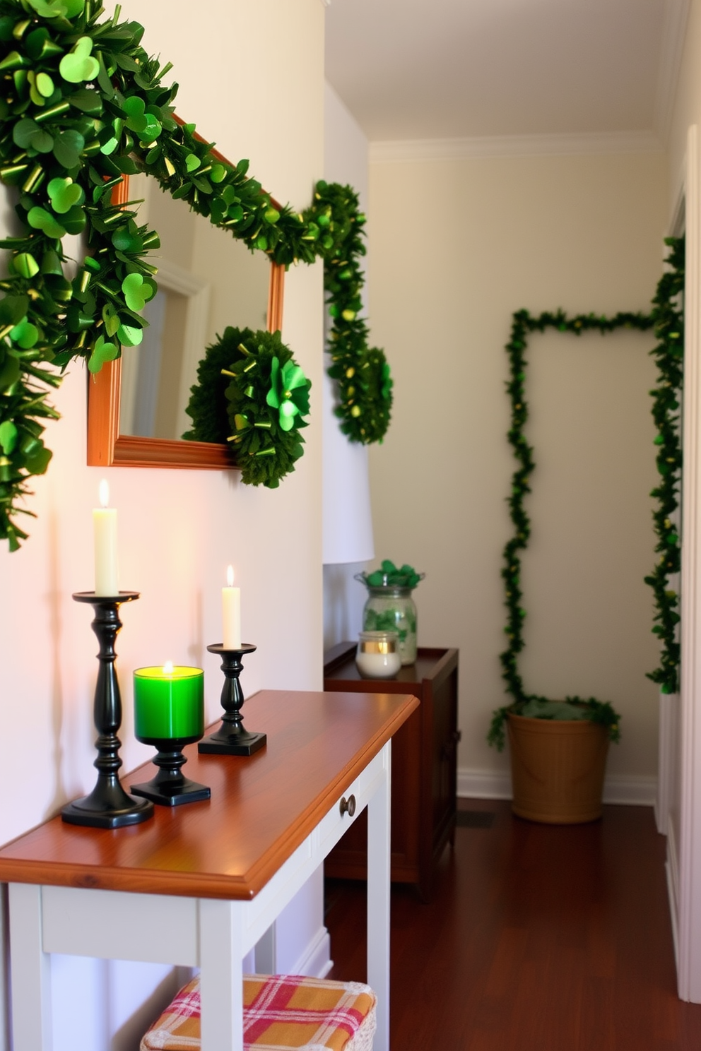 A cozy hallway adorned for St. Patrick's Day features festive candles in green glass holders placed along a wooden console table. The walls are decorated with cheerful green and gold garlands, creating a warm and inviting atmosphere.