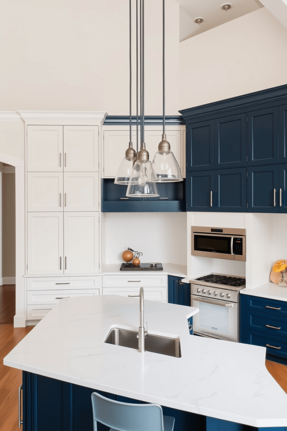 A high ceiling kitchen featuring two-tone cabinetry for visual interest. The upper cabinets are painted in a soft white, while the lower cabinets are a rich navy blue, creating a striking contrast. The kitchen island is topped with a large white quartz countertop, providing ample space for meal preparation and entertaining. Pendant lights with a modern design hang above the island, adding a touch of elegance to the space.