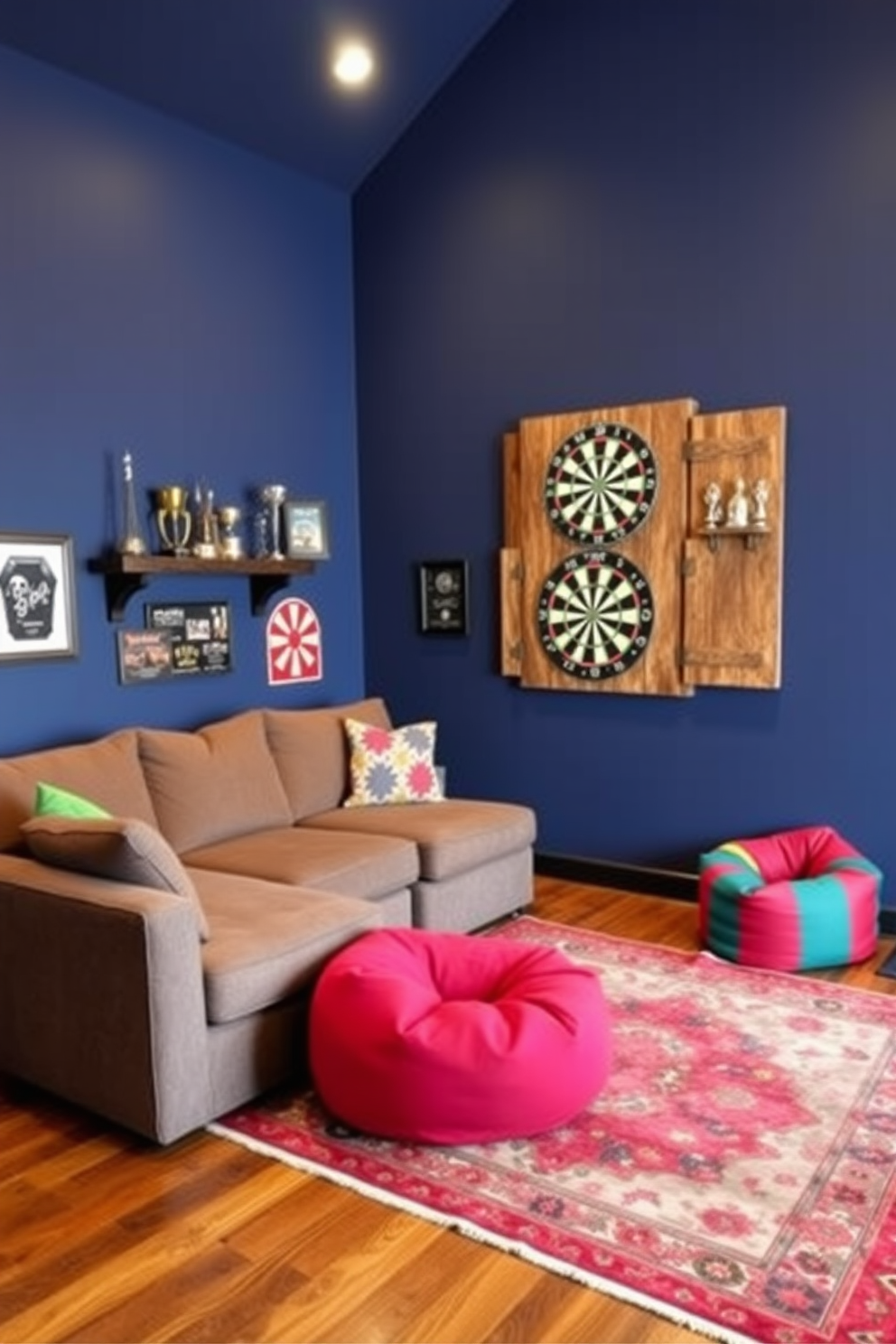 A vibrant home game room featuring a dartboard setup ideal for friendly competitions. The walls are painted in a deep navy blue, and a rustic wooden dartboard cabinet is mounted on the wall, flanked by shelves displaying trophies and memorabilia. Comfortable seating arrangements include a plush sectional sofa in a warm gray fabric, paired with colorful bean bags for a casual vibe. The flooring is a rich hardwood, complemented by a vintage area rug that adds a pop of color and texture to the space.