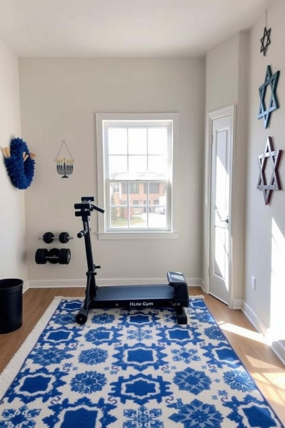 A cozy home gym setting designed for Hanukkah celebrations. The room features a festive rug with blue and white patterns, adding a cheerful touch to the workout space. In one corner, a set of weights is neatly arranged beside a large window that lets in natural light. Wall decorations include menorahs and Star of David motifs, creating a warm and inviting atmosphere for exercise and holiday spirit.