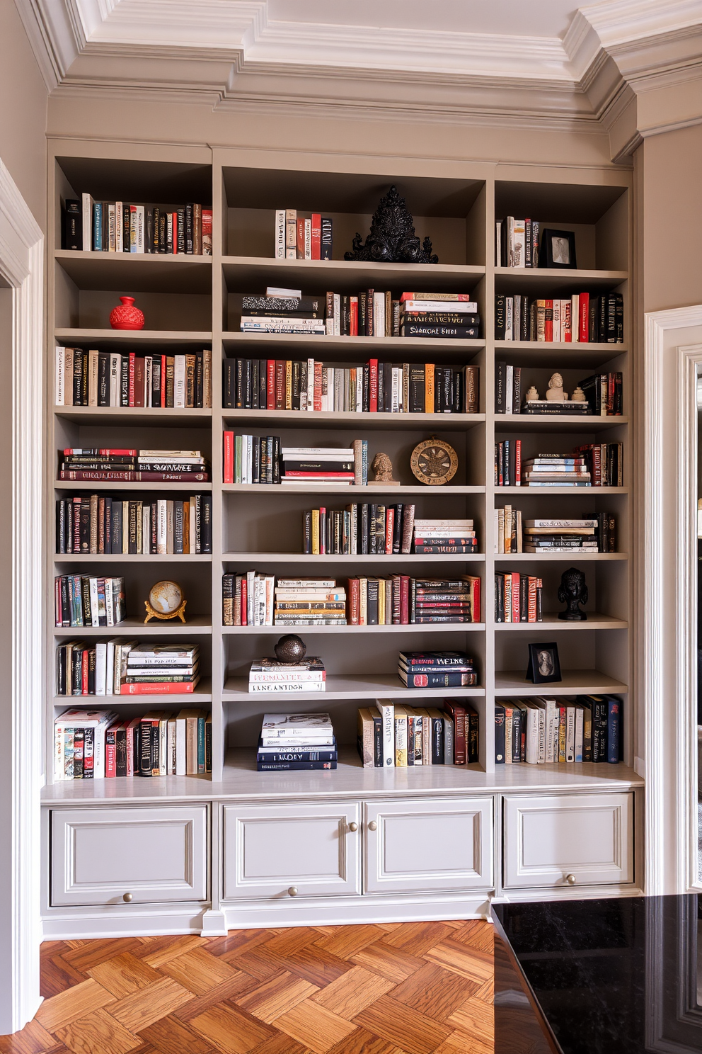 A stylish home library featuring elegant shelving units that reach from floor to ceiling. The shelves are adorned with decorative bookends, showcasing a curated collection of books and personal artifacts.