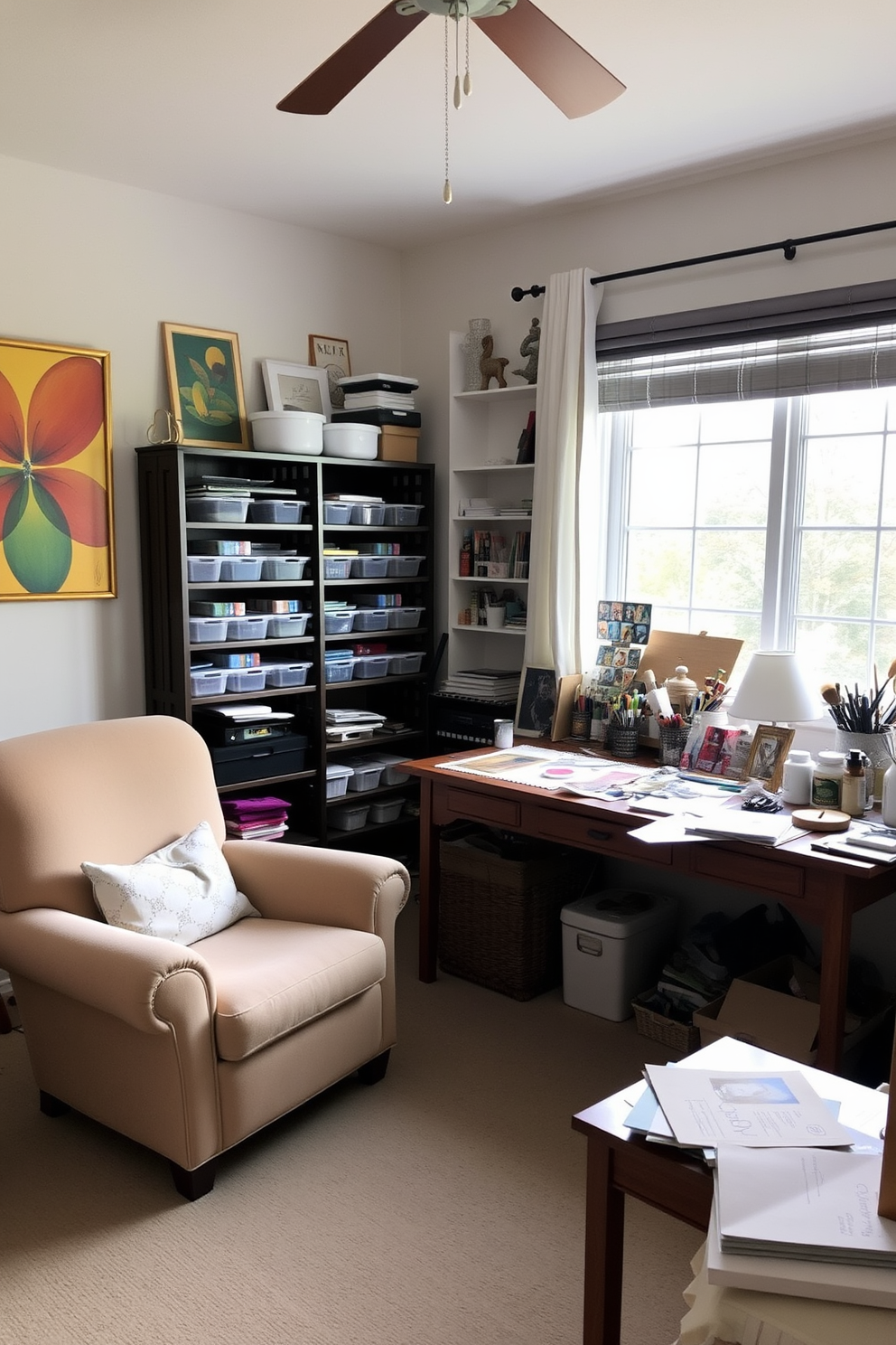 A cozy home office craft room featuring a plush armchair in the corner for relaxation. The walls are adorned with colorful artwork, and a large wooden desk is positioned by a window, allowing natural light to flood the space. The desk is cluttered with crafting supplies, including paints, brushes, and papers, reflecting a creative atmosphere. Shelves filled with neatly organized storage bins and books provide both functionality and style.