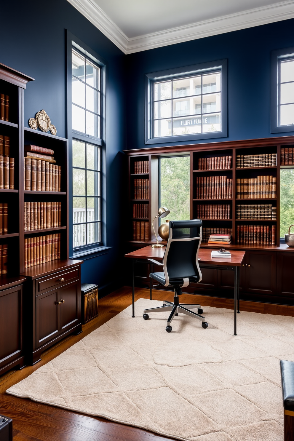 A bold accent wall painted in deep navy blue serves as the backdrop for a sophisticated home office. The room features a sleek wooden desk with a modern ergonomic chair, complemented by stylish bookshelves filled with leather-bound volumes. The floor is adorned with a plush area rug in neutral tones, adding warmth to the space. Large windows allow natural light to flood in, highlighting the rich textures of the dark wood furniture and the metallic accents throughout the room.