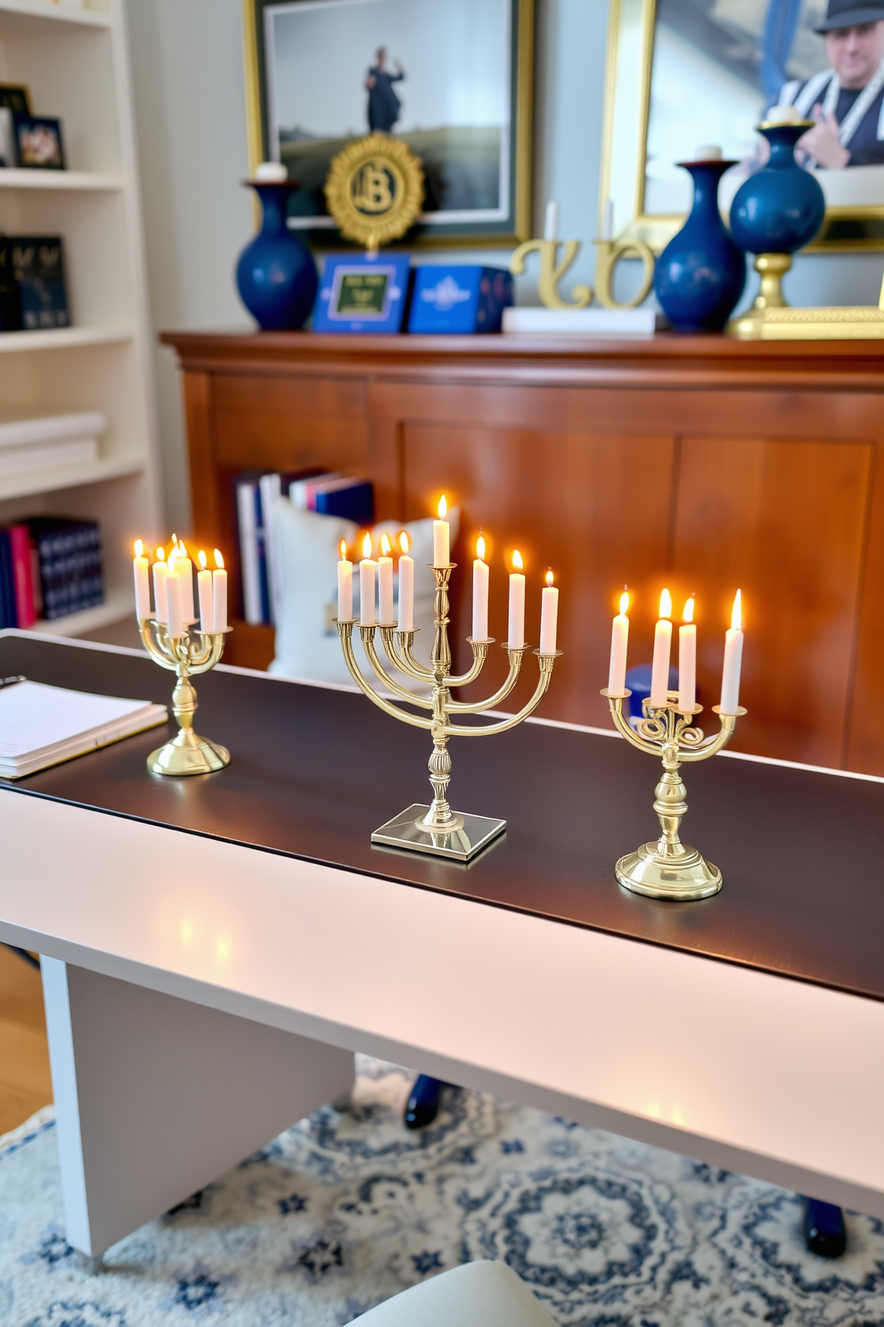 A home office decorated for Hanukkah features a sleek desk with a miniature menorah placed on each side. The warm glow of the candles creates a festive atmosphere, complemented by blue and gold accents throughout the room.