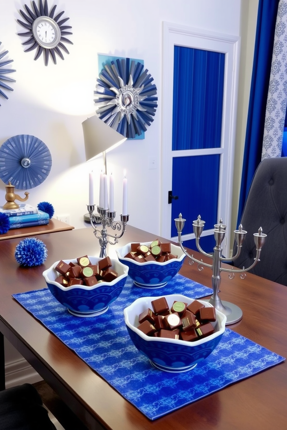 A cozy home office space decorated for Hanukkah. On the desk, decorative bowls filled with chocolate gelt are arranged alongside a menorah, creating a festive atmosphere. The walls are adorned with blue and silver accents, reflecting the colors of the holiday. Soft lighting from a stylish desk lamp casts a warm glow, enhancing the inviting feel of the room.