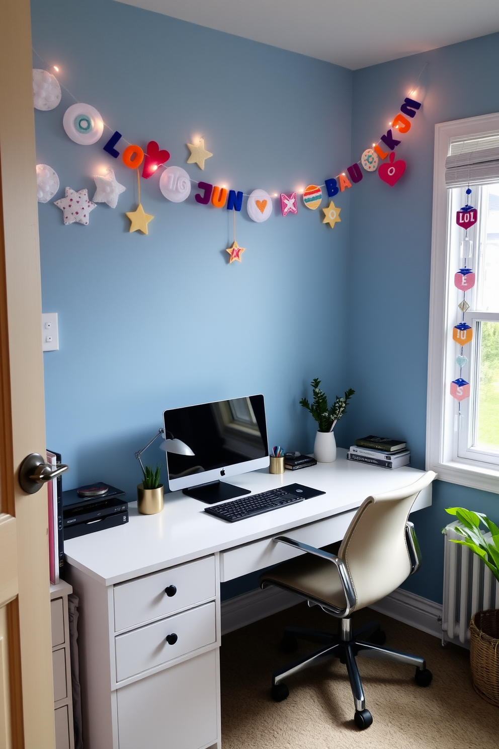 A cozy home office adorned with felt garlands featuring Hanukkah symbols. The walls are painted in a soft blue hue, and a stylish desk is positioned near a window, allowing natural light to illuminate the space.