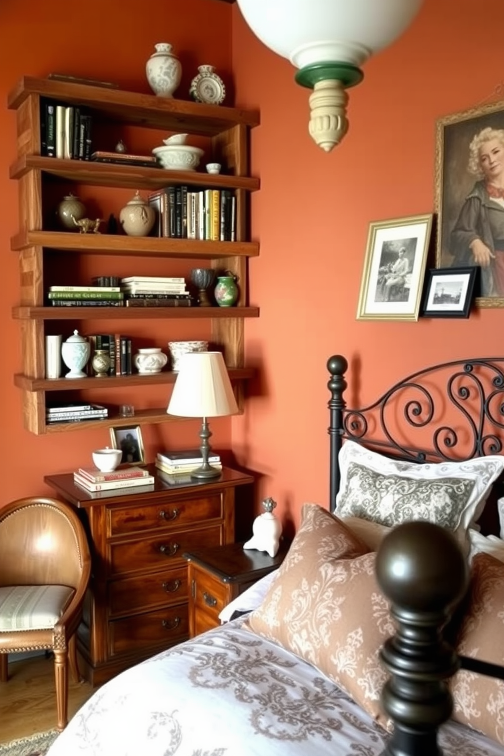 Open shelving elegantly displays decor items in a cozy Italian bedroom. The shelves are crafted from reclaimed wood and are adorned with a mix of books, decorative vases, and framed photographs. The walls are painted in warm terracotta tones, complementing the rich wooden furniture. A plush bed with intricate linens and a beautiful wrought iron headboard anchors the space, creating a serene atmosphere.