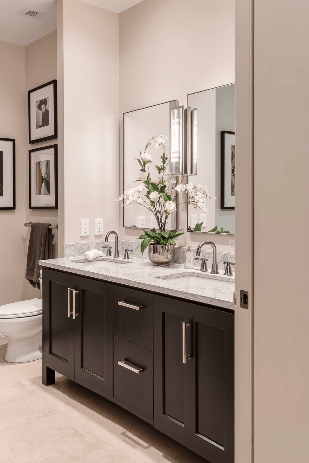 A stylish Jack and Jill bathroom features a double sink vanity with a sleek design. The vanity is adorned with elegant fixtures and a polished countertop that enhances the overall aesthetic. The walls are painted in a soft neutral tone, creating a calming atmosphere. Decorative elements such as framed artwork and lush greenery add a touch of sophistication to the space.