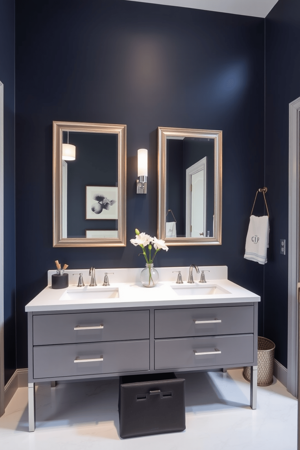 A bold accent wall painted in deep navy blue creates a dramatic focal point in the Jack and Jill bathroom. The space features dual vanities with sleek white countertops and modern fixtures, providing functionality and style. Framed mirrors above each sink reflect the striking wall color, enhancing the overall aesthetic. Soft lighting fixtures and elegant decor elements add warmth and sophistication to the design.