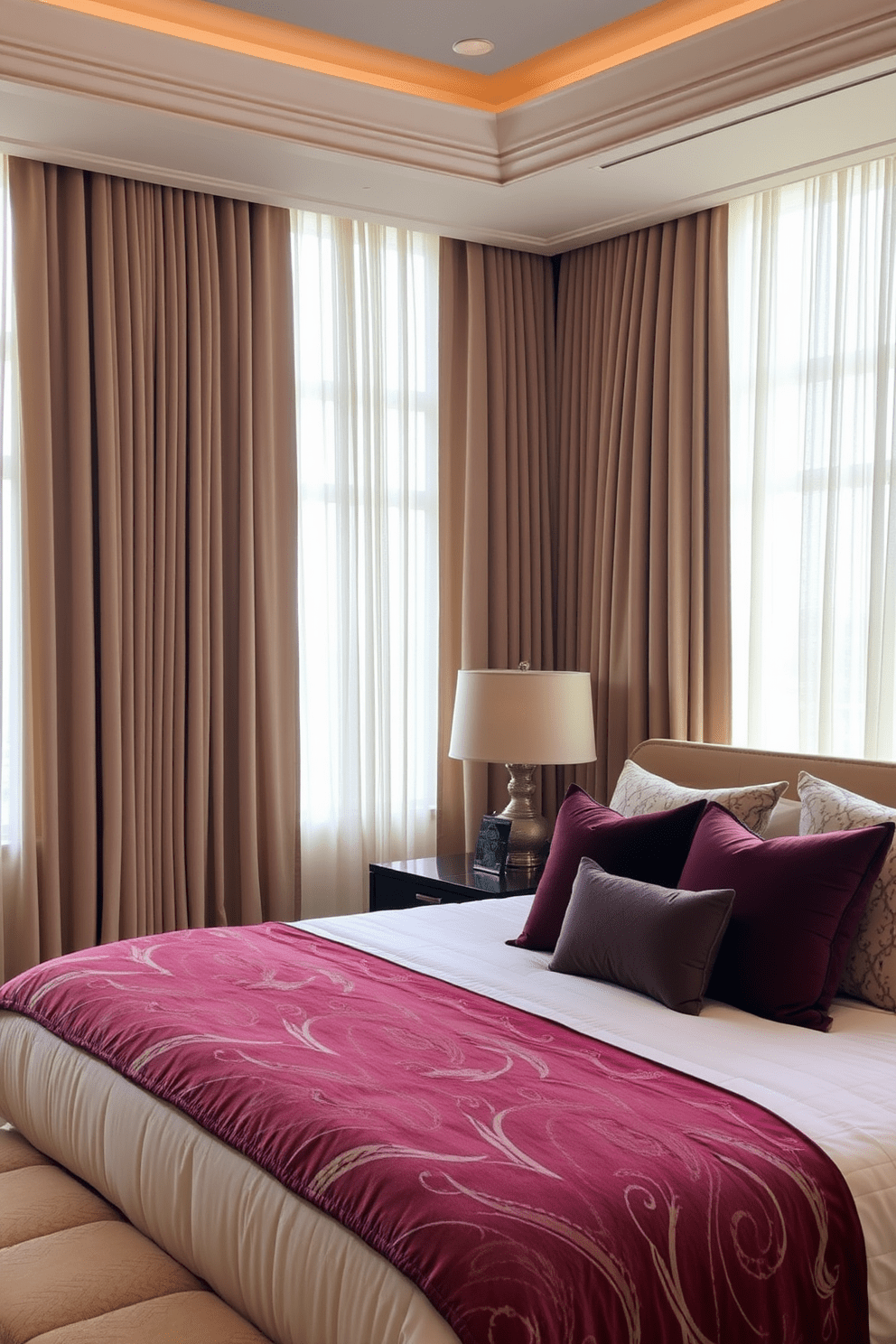 A luxurious king bedroom featuring layered curtains that add depth and texture to the space. The curtains are a mix of sheer and heavy fabrics, creating a soft and inviting atmosphere. The king-size bed is dressed in plush bedding with a combination of neutral and rich jewel tones. Accent pillows in various textures and patterns enhance the overall elegance of the room.