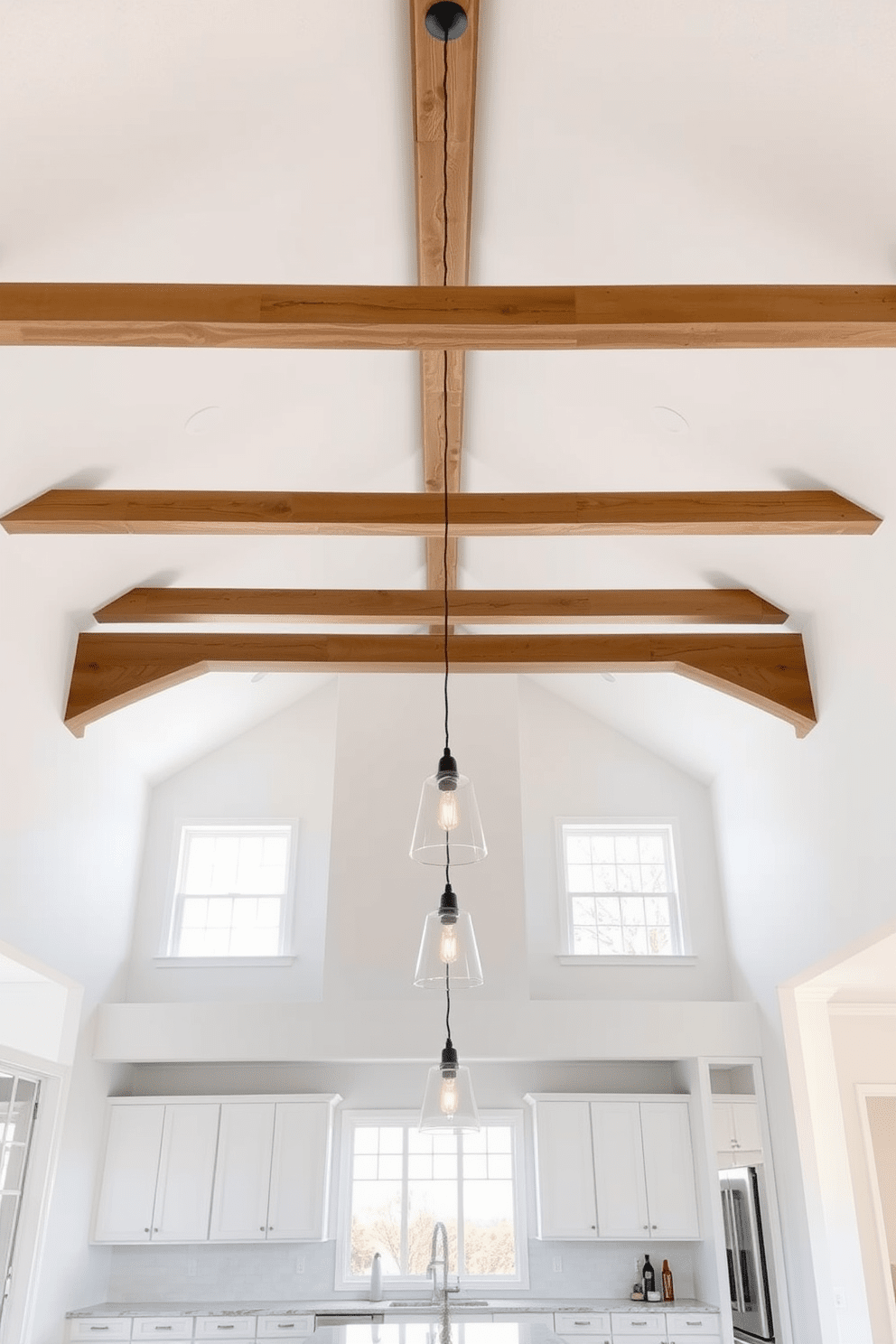 A vaulted ceiling creates an expansive and airy atmosphere in the kitchen, enhancing the overall sense of space. The design features exposed wooden beams that add warmth and character to the room. Bright white walls complement the natural light pouring in from large windows, creating a fresh and inviting environment. Pendant lighting hangs gracefully from the apex of the ceiling, providing both illumination and a stylish focal point.