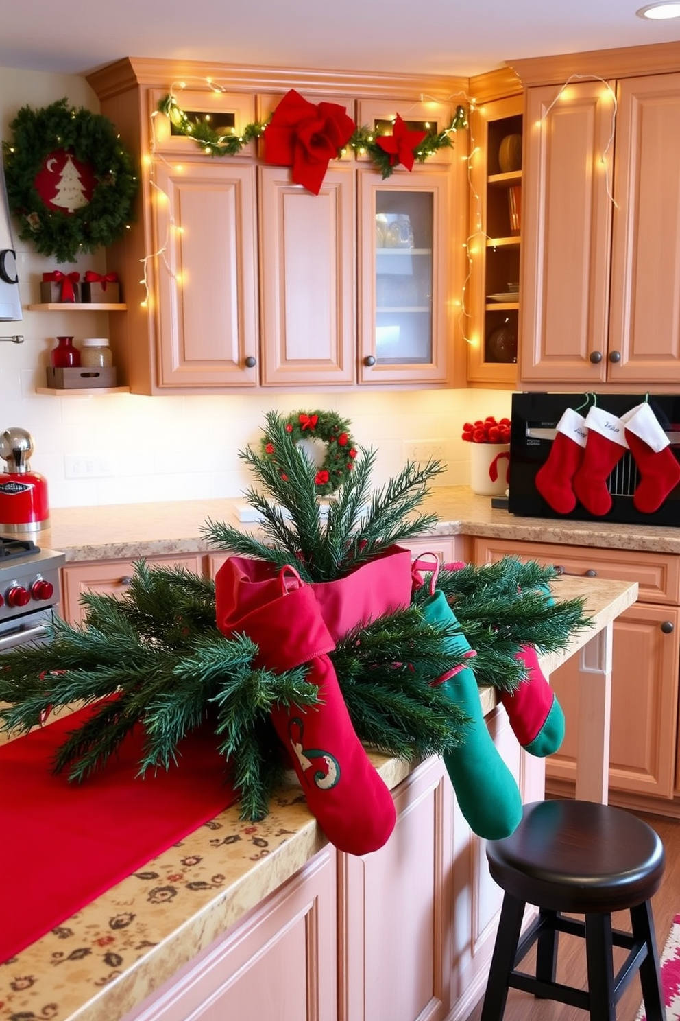 A festive kitchen adorned with red and green accents. The countertops are decorated with a vibrant red table runner and a centerpiece of fresh evergreen branches. Stockings in red and green hang from the kitchen island, adding a cheerful touch. Twinkling fairy lights are strung along the cabinets, creating a warm and inviting atmosphere.