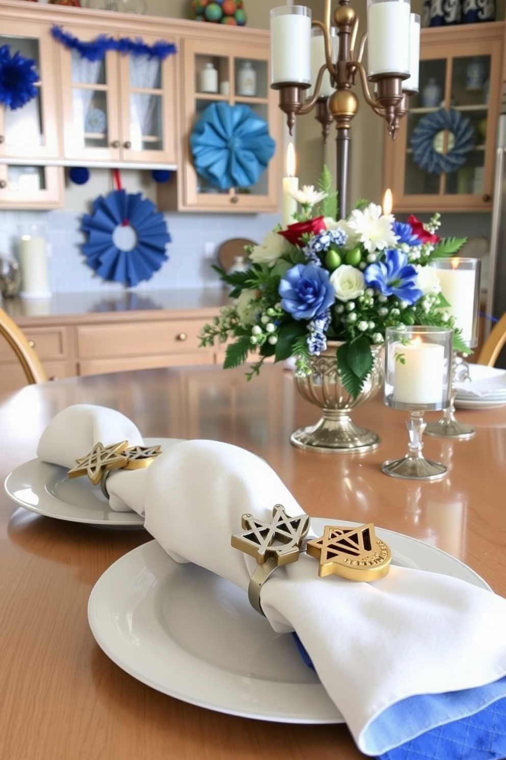 Festive napkin rings adorned with symbols of the season are elegantly displayed on a beautifully set dining table. The rings feature traditional designs such as menorahs and dreidels, adding a touch of holiday spirit to the festive table setting. In the background, a cozy kitchen is decorated with Hanukkah-themed accents. Blue and silver decorations hang from the cabinets, and a beautifully arranged centerpiece showcases seasonal elements like candles and fresh flowers.