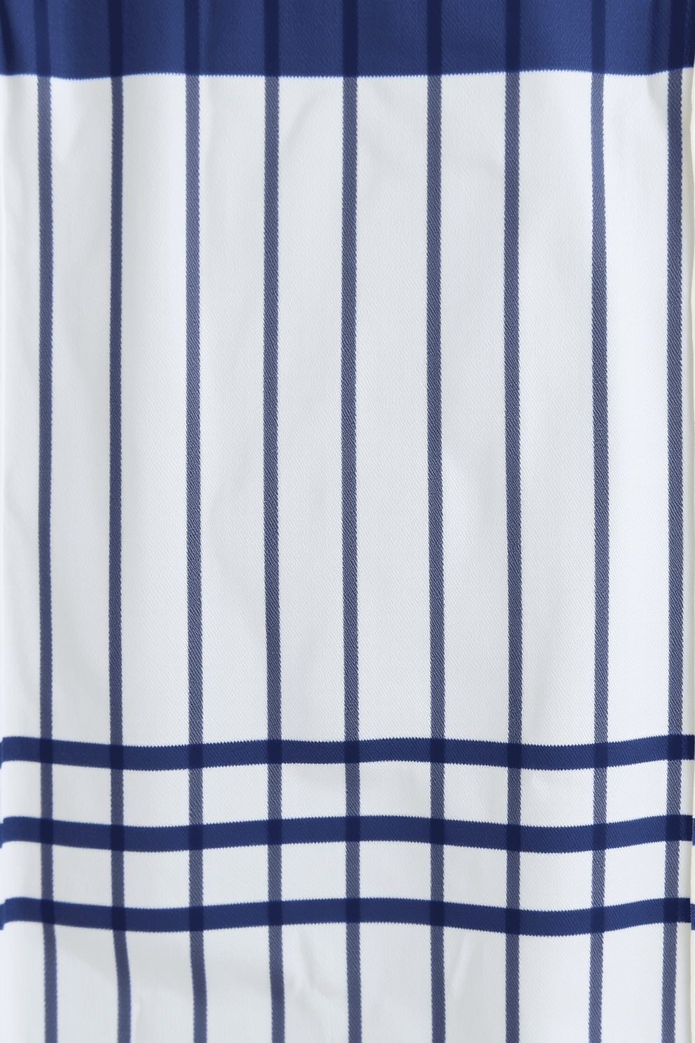 A classic kitchen towel design featuring timeless stripes in shades of navy blue and crisp white. The fabric has a soft texture, making it both functional and stylish, perfect for any kitchen decor. The stripes are evenly spaced, creating a harmonious balance that enhances the overall aesthetic. This design pairs beautifully with rustic or modern kitchen themes, adding a touch of sophistication.